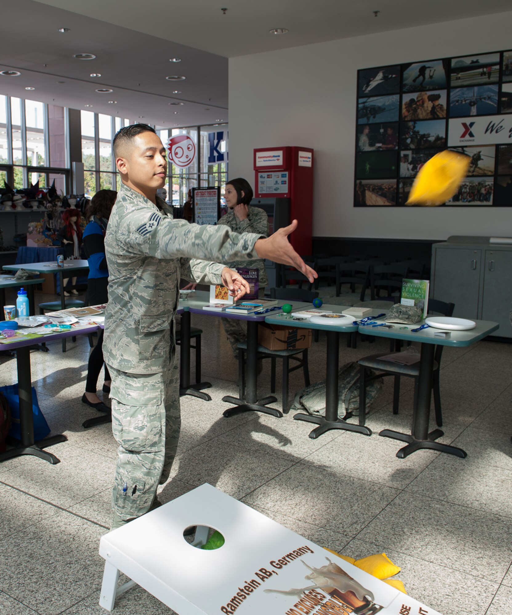 Staff Sgt. Erick Alvarez, 86th Medical Support Squadron diagnostic imaging technician, throws a bean bag in a game at a suicide prevention fair Sept. 22, 2016, at Ramstein Air Base, Germany. This is the second consecutive year the fair has been held.
