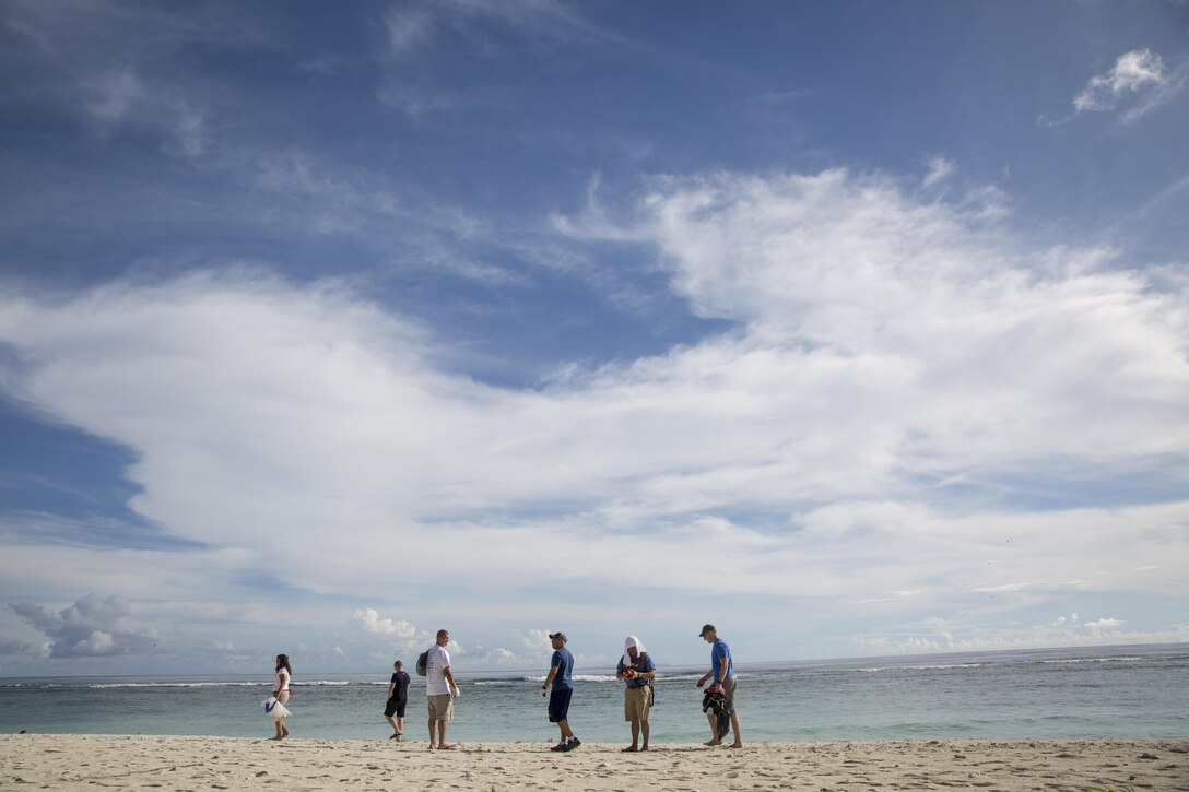 Marines and Sailors participating in Exercise Valiant Shield 16 look for trash during the 2016 International Coastal Cleanup on Andersen Air Force Base, Guam, Sept. 17, 2016. Members participating in VS16 formed a joint task force of approximately 120 members with home-stationed personnel and their families. This team went on to spend five hours collecting, bagging and tagging 20 bags of trash and 10 bags of recyclables. (U.S. Marine Corps photo by Sgt. Ally Beiswanger)