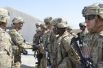 Lt. Gen. Stephen J. Townsend, commander Combined Joint Task Force Operation Inherent Resolve, awards a coin to Private First Class Nathaniel Hill, Utilities Equipment Repairer with Golf Company, 526th Brigade Support Battalion, Task Force Strike, 101st Airborne Division (Air Assault), stationed at Fort Campbell, Kentucky. Coalition troops arrived to Qayyarah West Airfield to enable the Iraqi Security Forces to defeat Da'esh by providing logistical, engineering and artillery fires in support of the liberation of Mosul. The mission of Operation Inherent Resolve is to defeat Da’esh (an Arabic acronym for ISIL) in Iraq and Syria by supporting the Government of Iraq with trainers, advisors and fire support, to include aerial strikes and artillery fire. (USMC photo by Capt. Ryan E. Alvis/Released)