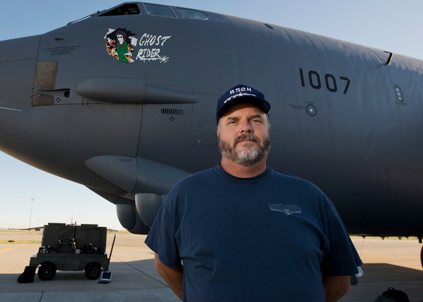 Robert Crane, 5th Logistics Readiness Squadron vehicle management flight chief, stands next to the B-52H Stratofortress Ghost Rider at Minot Air Force Base, N.D., Sept. 27, 2016. Crane, who was the primary crew chief on Ghost Rider when it was stationed here in the 90s and named the aircraft, came to see its return to Minot. (U.S. Air Force photo/Airman 1st Class J.T. Armstrong)