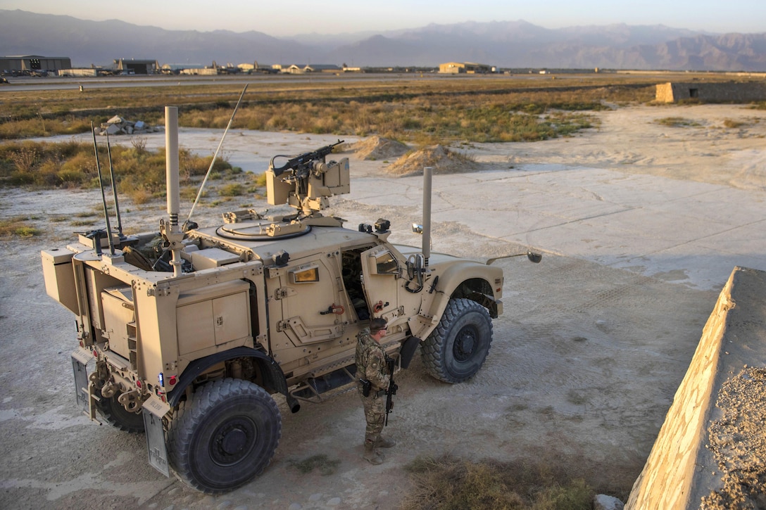 Air Force Senior Airman Michael Van Deusen gets out of a mine-resistant, ambush-protected vehicle during a flightline security patrol at Bagram Airfield, Afghanistan, Sept. 27, 2016. Deusen is a quick reaction force member assigned to the 455th Expeditionary Security Forces Squadron. Air Force photo by Senior Airman Justyn M. Freeman