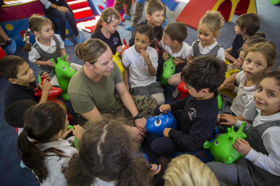 Women with a U.S. Marine Female Engagement Team operating in Europe interact with students at the Cambridge School of Constanta, Romania, 28 Sept., 2016.  The Marines spent two weeks doing military-to-military and military-to-civilian engagements to enhance regional security and stability. (U.S. Marine Corps photo by Sgt. Michelle Reif)
