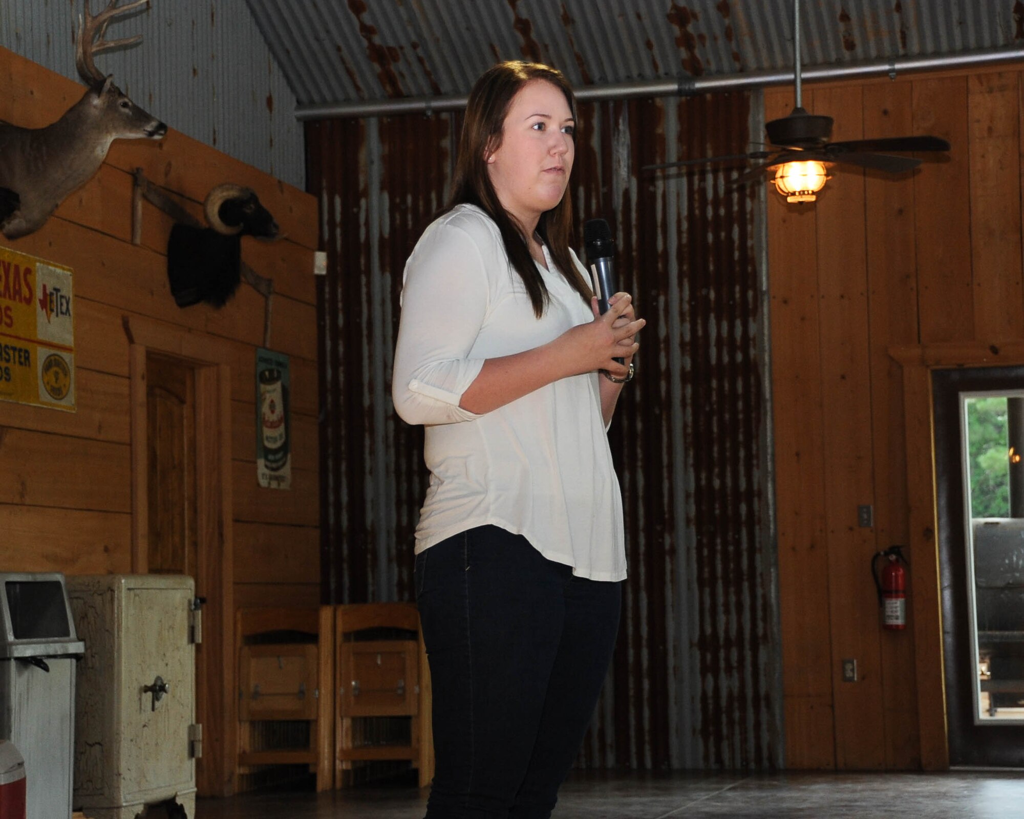 Airman 1st Class Kelsey Bachmeier, 2nd Medical Group pharmacy technician, speaks about her Operation Bright Holiday experience at Los Paloma Sporting Range in Benton, La., Sept. 23, 2016. Since its inception nine years ago, the number of Airmen sent home increases each year. Last year 68 Airmen were selected by OBH to go home for the holidays. (U.S. Air Force photo/Airman 1st Class Stuart Bright)