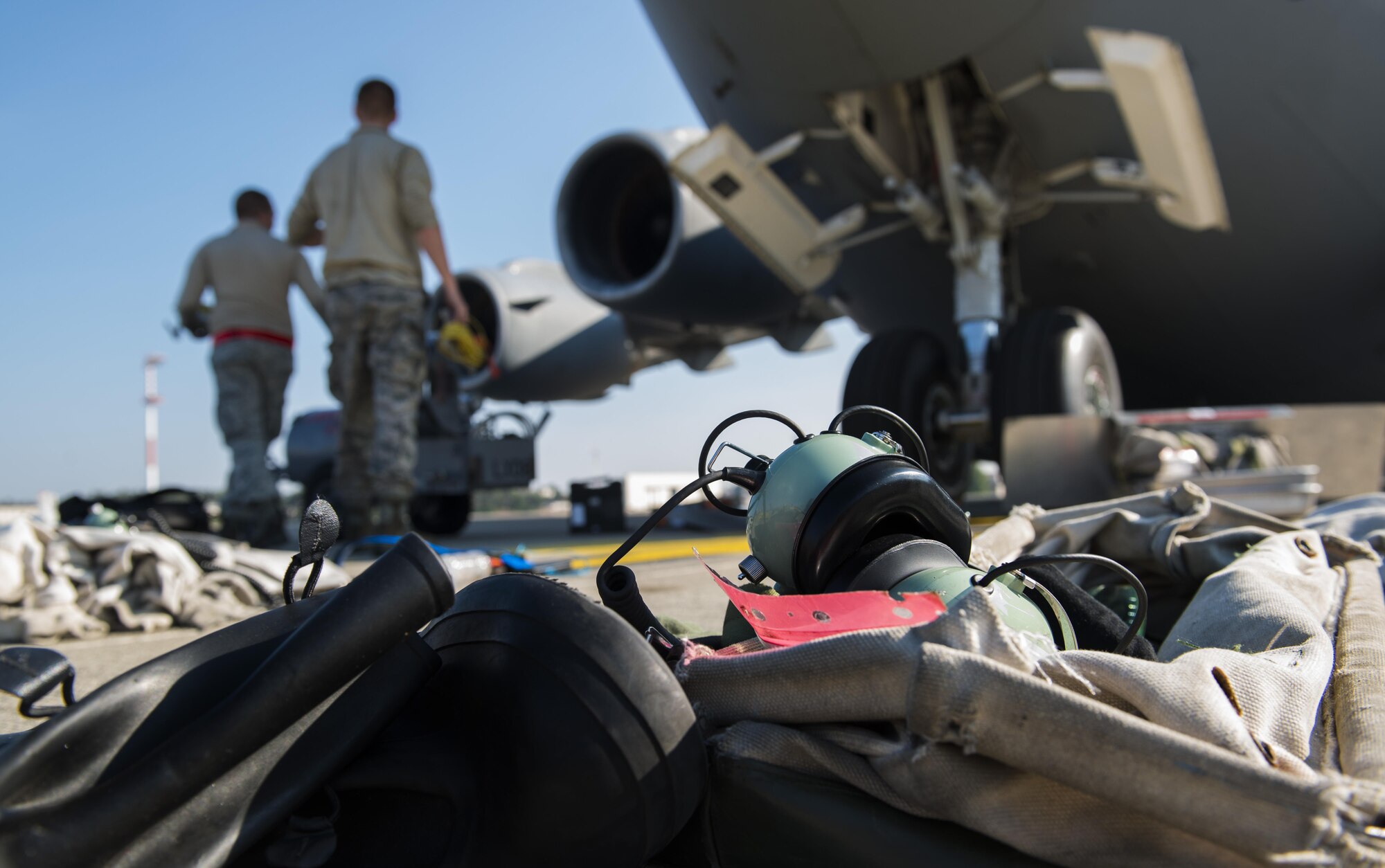 Personal protective equipment lays on the flightline before Airmen from the 721st Aircraft Maintenance Squadron service liquid oxygen for a C-17 Globemaster III Sept. 22, 2016 at Ramstein Air Base, Germany. Liquid oxygen can cause severe burns, so while the Airmen pump it into the aircraft, they are required to wear protective gear. 