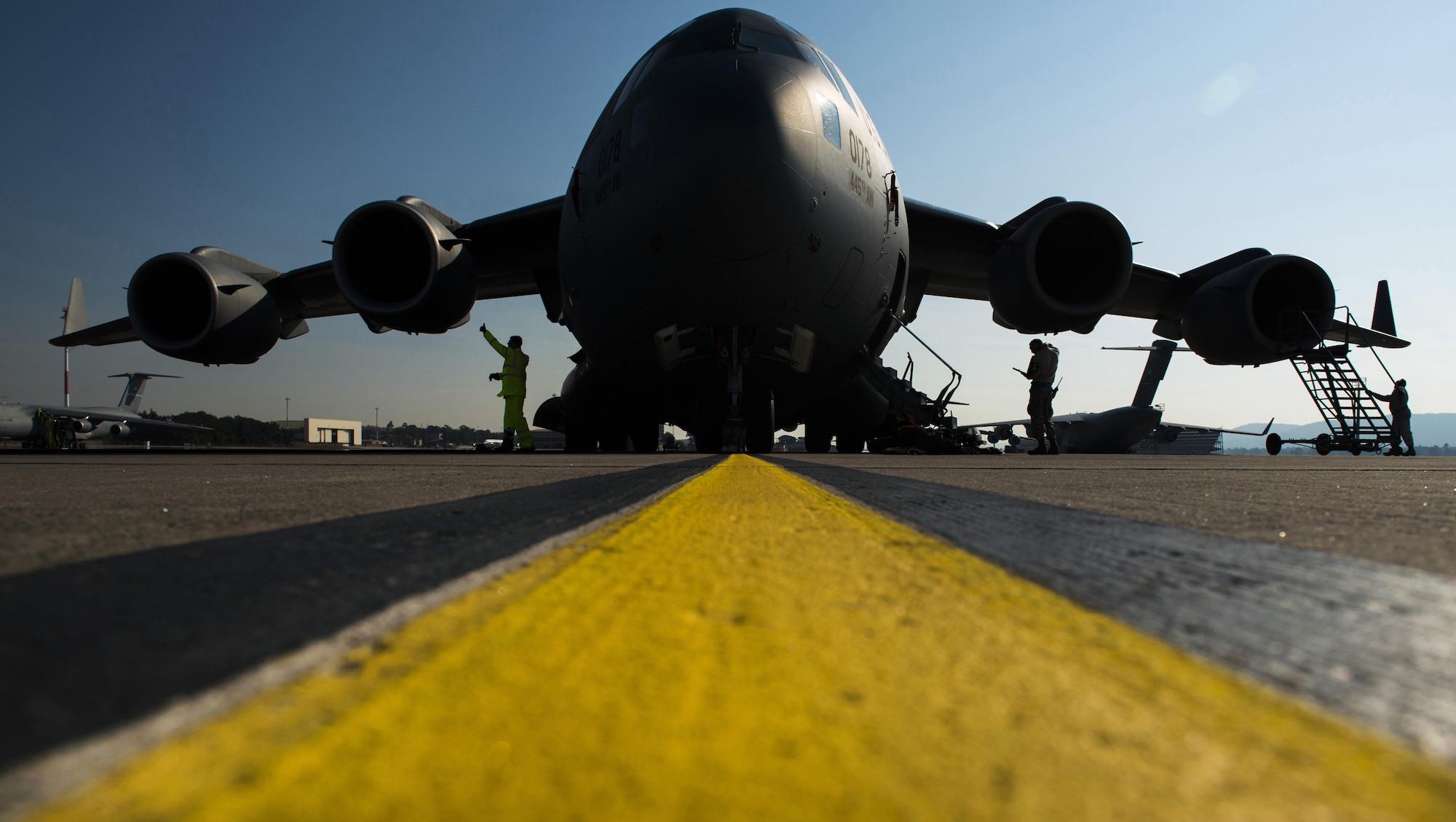 Airmen from the 452nd Maintenance Squadron perform a routine inspection of a C-17 Globemaster III Sept. 22, 2016 at Ramstein Air Base, Germany. Airmen from the 452nd MXS worked with the 721st Aircraft Maintenance Squadron while at Ramstein for a temporary duty. Every aircraft flying in and out of Ramstein undergoes an inspection to ensure nothing has broken or malfunctioned. (U.S. Air Force photo/Senior Airman Tryphena Mayhugh)