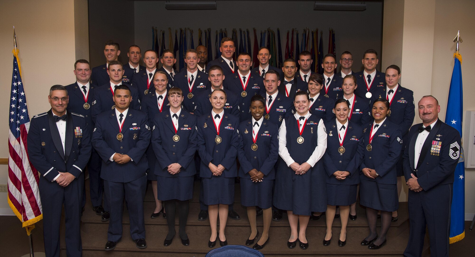 Col. Stephen Kravitsky, 90th Missile Wing commander, and Chief Master Sgt. Kristian Farve, 90th Operations Group superintendent, pose with the graduating Airman Leadership School Class 16-G students at F.E. Warren Air Force Base, Wyo., Sept. 28, 2016. Enlisted Airmen must complete the rigorous professional military education course to become supervisors of other Airmen. (U.S. Air Force photo by Staff Sgt. Christopher Ruano)