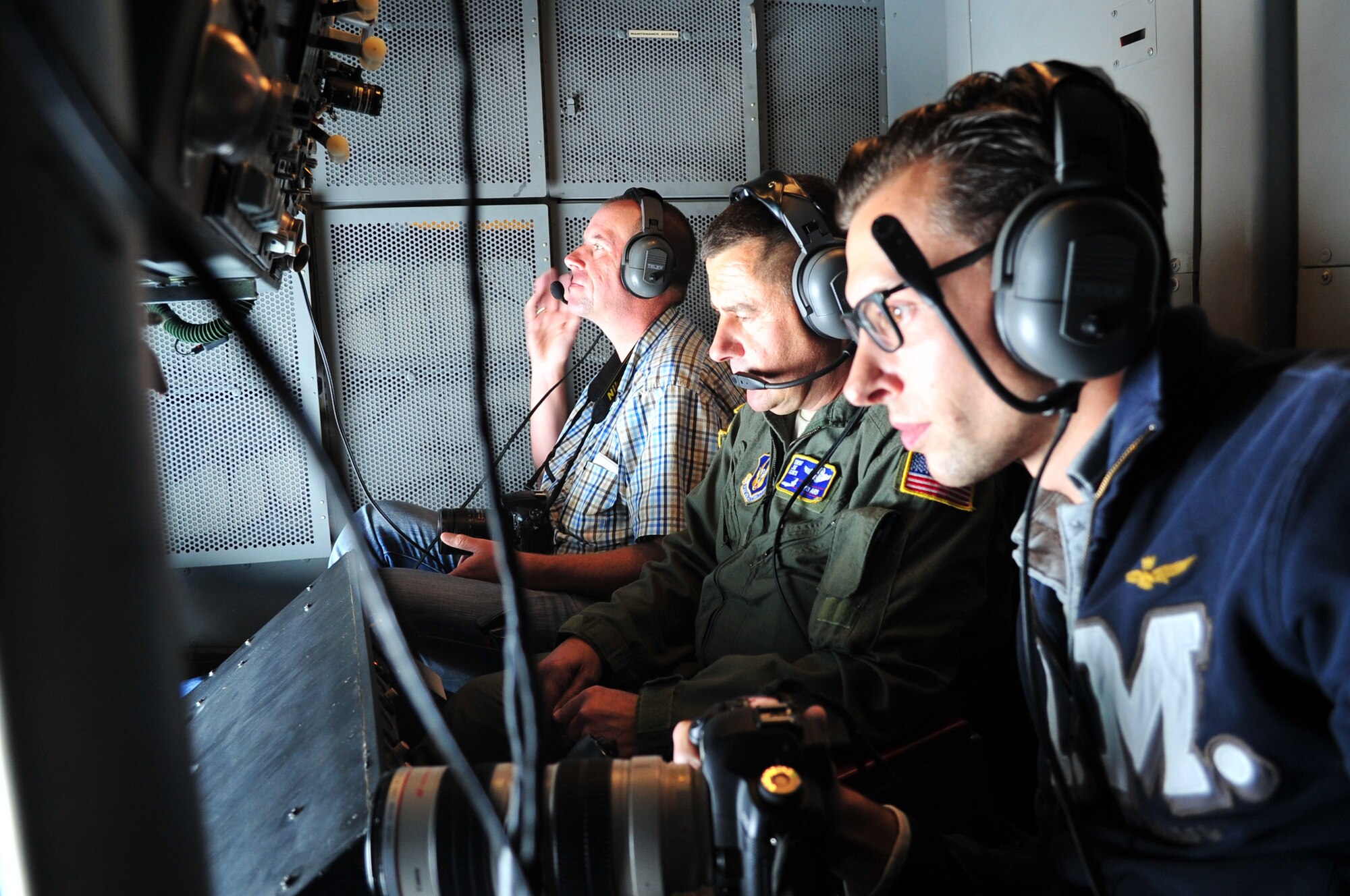 Global Aviation Press Review photographers, Ramon Wenink, right, and Martin Gerhard, far left, cover a local training mission Sept. 21, of a KC-10 Extender refueling a F-16 Fighting Falcon. Reserve tanker aircrews with the 514th Air Mobility Wing at Joint Base McGuire-Dix-Lakehurst, N.J., often support the fighters assigned to the Air National Guard's 121st Fighter Squadron at Joint Base Andrews, MD. (U.S. Air Force photo/Master Sgt. Donna T. Jeffries)