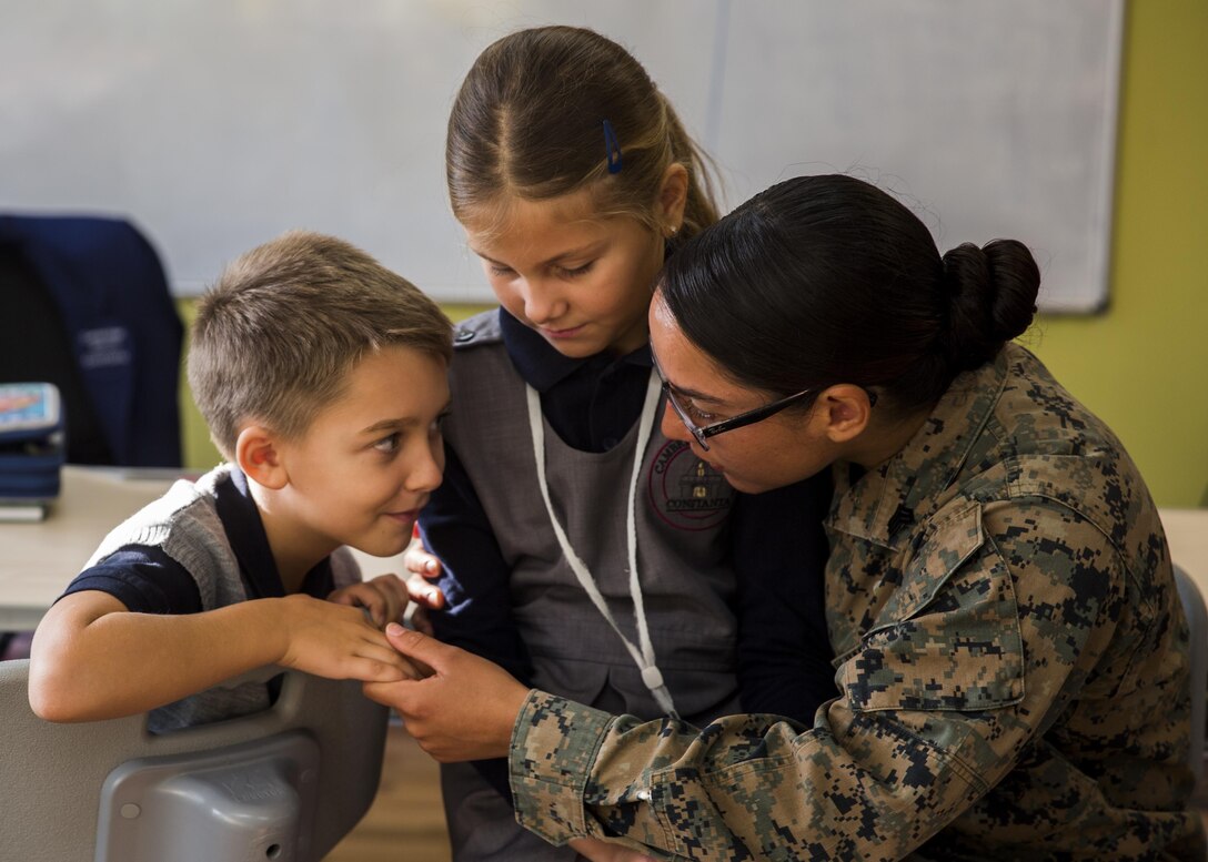 Women with a U.S. Marine Female Engagement Team operating in Europe interact with students at the Cambridge School of Constanta, Romania, 28 Sept., 2016.  The Marines spent two weeks doing military-to-military and military-to-civilian engagements to enhance regional security and stability. (U.S. Marine Corps photo by Sgt. Michelle Reif)