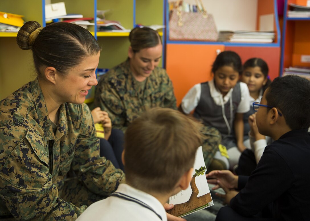 Women with a U.S. Marine Female Engagement Team operating in Europe interact with students at the Cambridge School of Constanta, Romania, 28 Sept., 2016.  The Marines spent two weeks doing military-to-military and military-to-civilian engagements to enhance regional security and stability. (U.S. Marine Corps photo by Sgt. Michelle Reif)