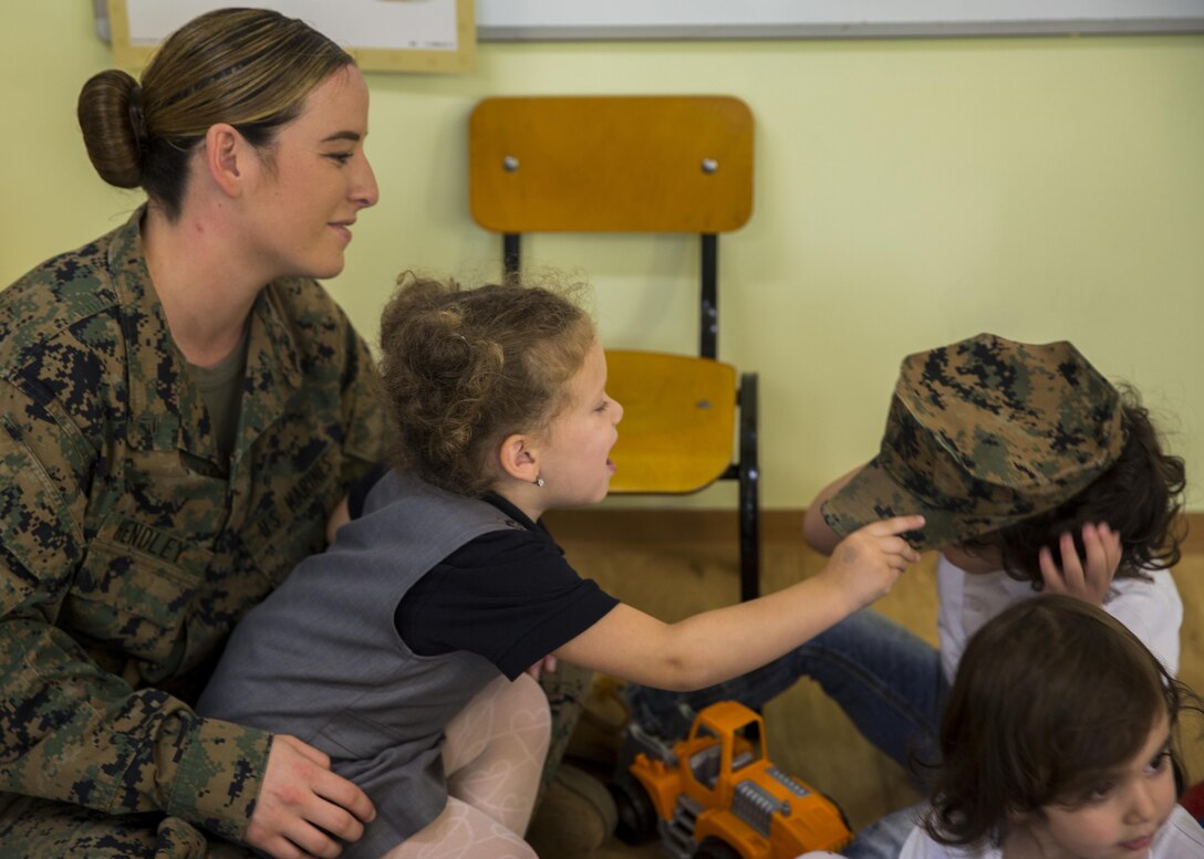 Women with a U.S. Marine Female Engagement Team operating in Europe interact with students at the Cambridge School of Constanta, Romania, 28 Sept., 2016.  The Marines spent two weeks doing military-to-military and military-to-civilian engagements to enhance regional security and stability. (U.S. Marine Corps photo by Sgt. Michelle Reif)