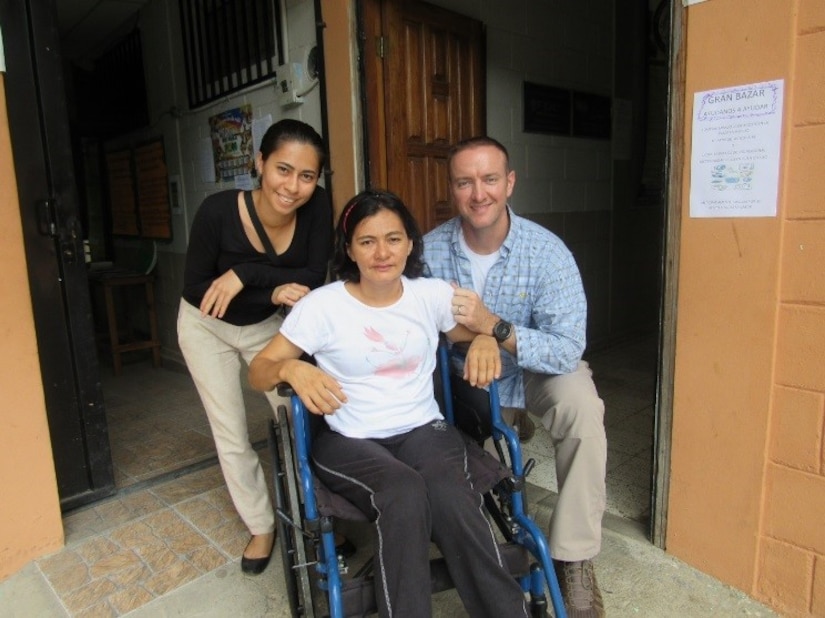 U.S. Army Maj. Jonathan Reagan, Joint Task Force Bravo Medical Element physical therapist, poses with one of the Honduran patients he provides care for during weekly visits to Centro de Rehabilitación Integral de Comayagua, August 3, 2016. This patient in particular inspired Reagan to begin a fundraiser to provide financial help to patients whose lives have been dramatically impacted by their injuries. (U.S. Army photo by 1st Lt Jenniffer Rodriguez)