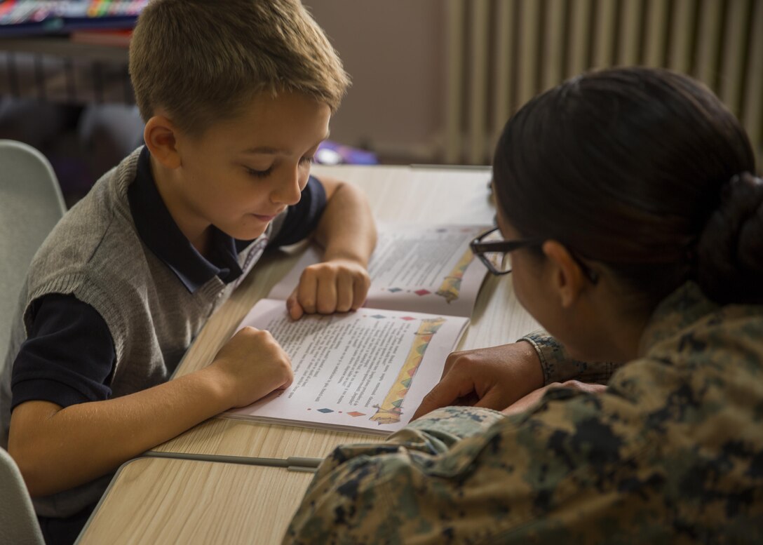 Women with a U.S. Marine Female Engagement Team operating in Europe interact with students at the Cambridge School of Constanta, Romania, 28 Sept., 2016.  The Marines spent two weeks doing military-to-military and military-to-civilian engagements to enhance regional security and stability.