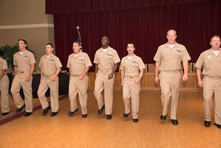 Chief Petty Officer selectees sing "Anchors Aweigh" during a promotion ceremony September 16, 2016. Fifteen Sailors from various units in South Carolina were presented with their new rank in a traditional ceremony at the Red Bank Club on Joint Base Charleston-Naval Weapons Station.