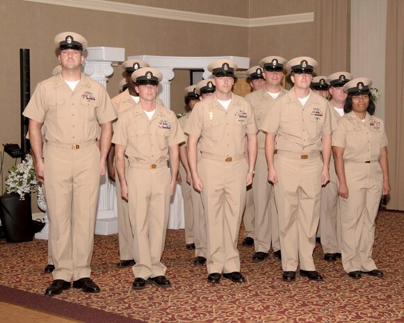 Chief Petty Officers stand in formation during a promotion ceremony September 16, 2016. Fifteen Sailors from various units in South Carolina were presented with their new rank in a traditional ceremony at the Red Bank Club on Joint Base Charleston-Naval Weapons Station.