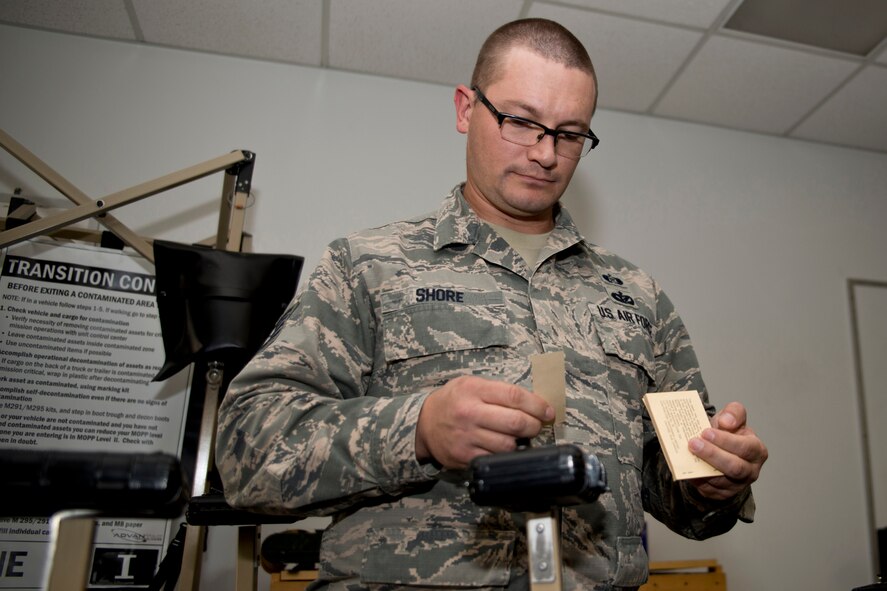 U.S. Air Force Reserve Tech. Sgt. David Shore, emergency management specialist, 913th Force Support Squadron, demonstrates the preparation of a Liquid Detection Point (LDP) at Little Rock Air Force Base, Ark., Sept. 28, 2016. An LDP uses M8 Chemical Detection Paper to identify the presence of Nerve and Blister Agents. Shore teaches the hands-on portion of the Chemical, Biological, Radiological and Nuclear Survival Skills Course to Reservists assigned to the 913th Airlift Group at Little Rock AFB. (U.S. Air Force photo by Master Sgt. Jeff Walston/Released)