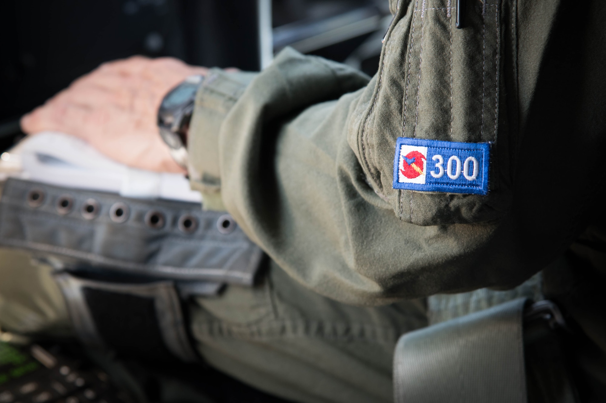 Lt. Col. Troy “Bear” Anderson, 53rd Weather Reconnaissance Squadron pilot sits in the cockpit during the final flight of his Air Force career. The 300 on his uniform indicates the number of times he has penetrated the eye of a hurricane. (U.S. Air Force photo/Senior Airman Heather Heiney) 