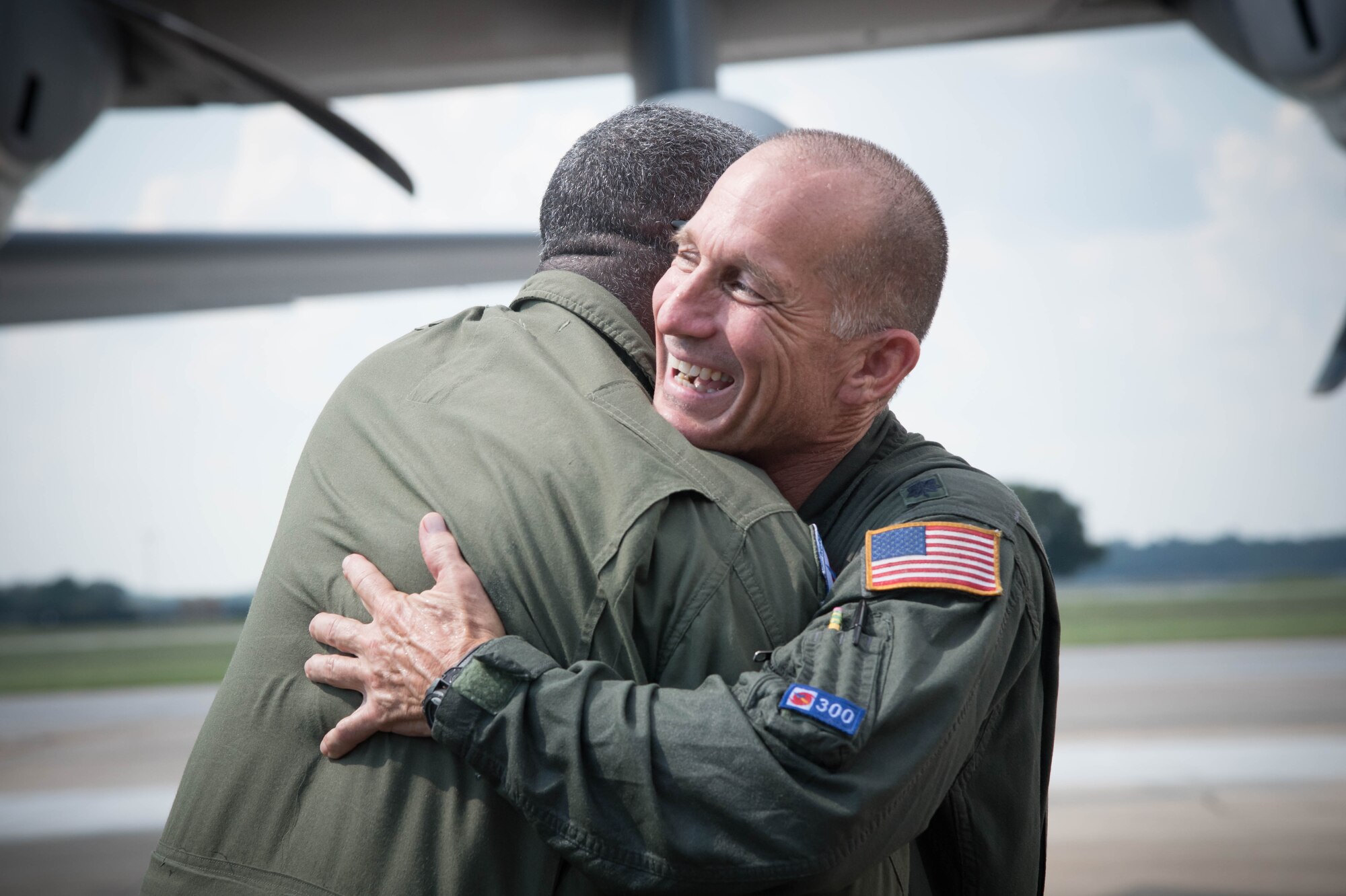 Lt. Col. Troy “Bear” Anderson, 53rd Weather Reconnaissance Squadron pilot hugs, Master Sgt. Troy Bickham, 53rd WRS loadmaster, after the final flight of his Air Force career. (U.S. Air Force photo/Senior Airman Heather Heiney) 