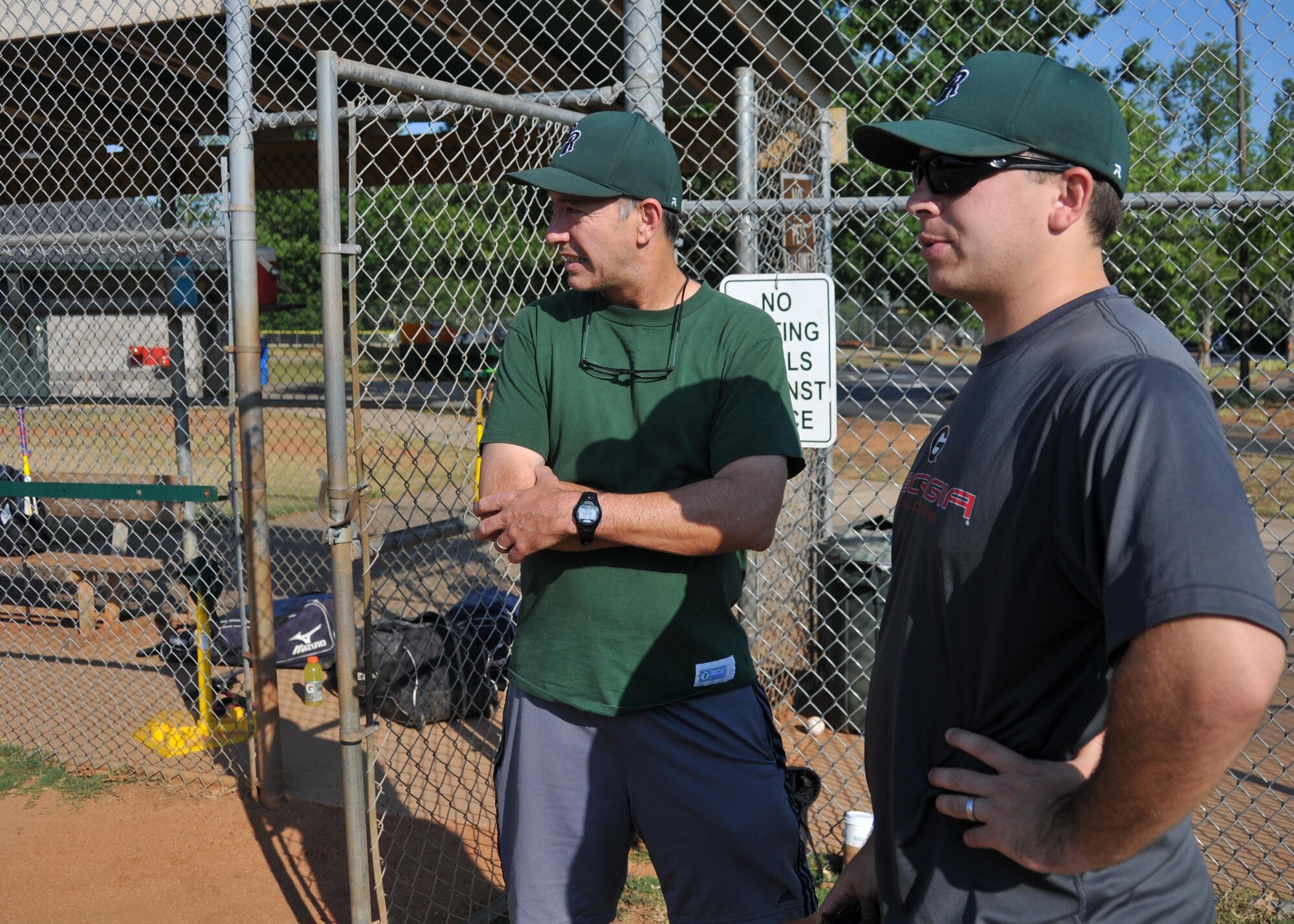 First Lt. Rick Hagauer, a 700th Airlift Squadron pilot, observes his players during baseball practice at Hembree Park in Roswell, Ga. on July 2, 2016. Hagauer has a long history of playing baseball that dates back to when he was an adolescent in Peachtree City. (U.S. Air Force photo by Senior Airman Andrew J. Park) 
