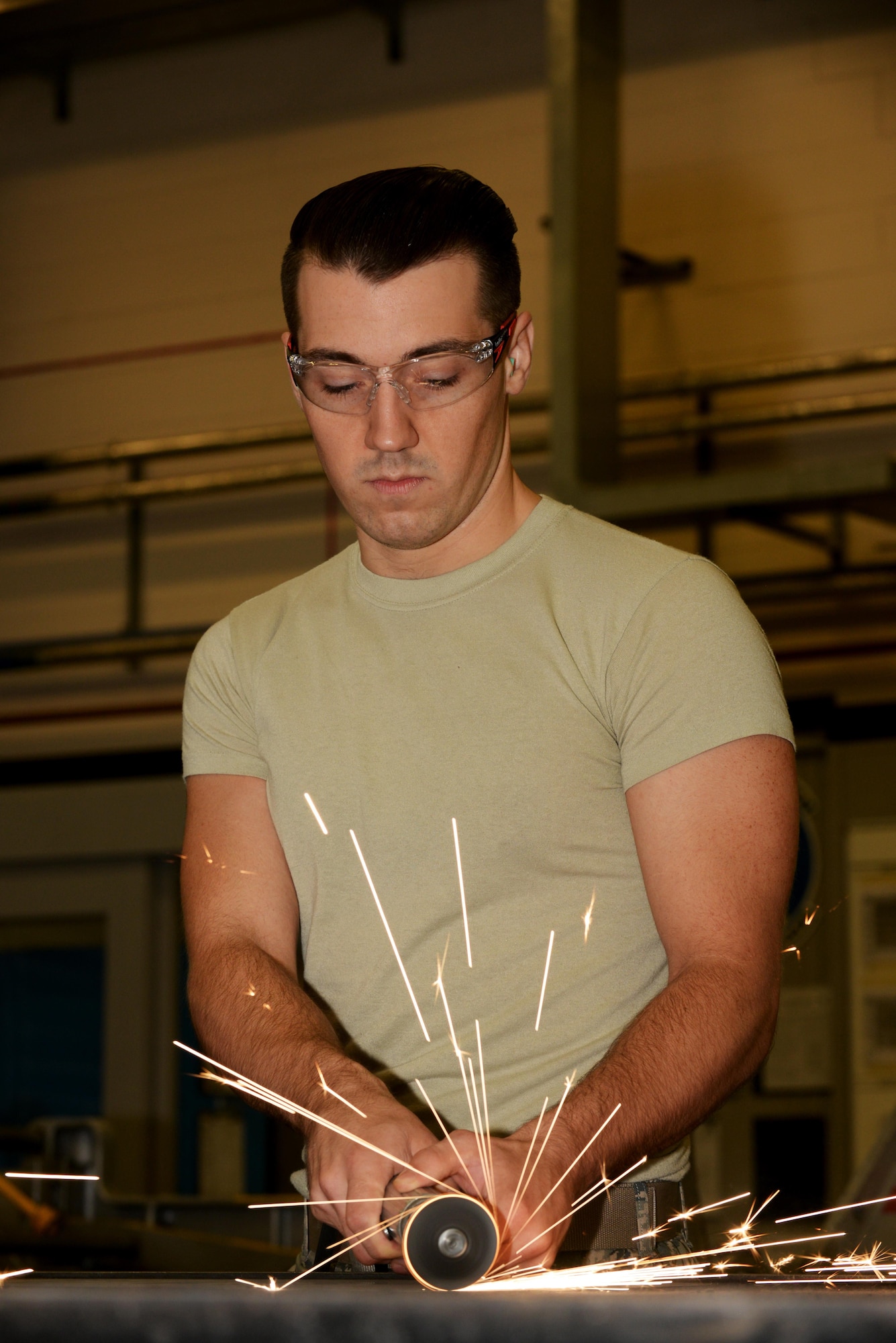 U.S. Air Force Staff Sgt. Alan Hall, 100th Maintenance Squadron Aircraft Structural Maintenance craftsman, poses for a photograph in his work center Sept. 29, 2016, on RAF Mildenhall, England. Hall was submitted for the Square D Spotlight for being an outstanding member of Team Mildenhall. (U.S. Air Force photo by Airman 1st Class Tenley Long) 