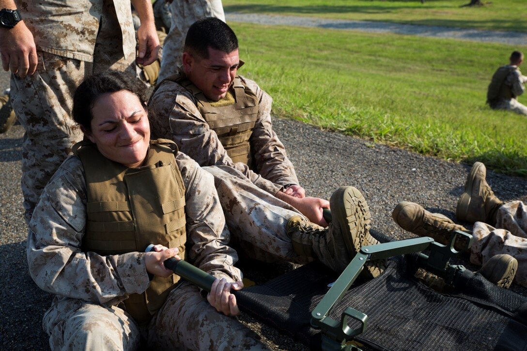 Marines in Corporals Course 4-16 prepare a litter for a casualty during a casualty and resupply run at Marine Forces Reserve, Sept. 28, 2016. The course is designed to provide Marine Corps Corporals with knowledge and skills necessary to become successful small-unit leaders using problem-based situations that they may encounter in the future. (U.S. Marine Corps photo by Cpl. Melissa Martens/ Released)  