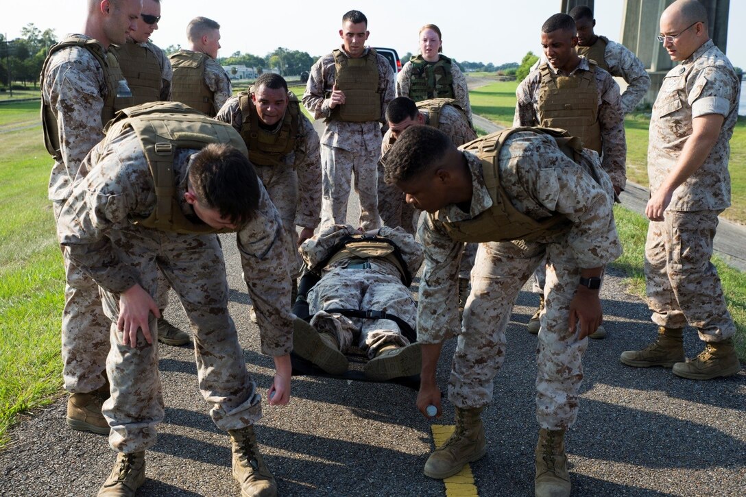 Marines in Corporals Course 4-16 take part in a casualty and resupply run at Marine Forces Reserve, Sept. 28, 2016. The run was the final physical training event for the course and each participant had to stay mentally and physically tough to accomplish the mission. The course is designed to provide Marine Corps Corporals with knowledge and skills necessary to become successful small-unit leaders. (U.S. Marine Corps photo by Cpl. Melissa Martens/ Released)  