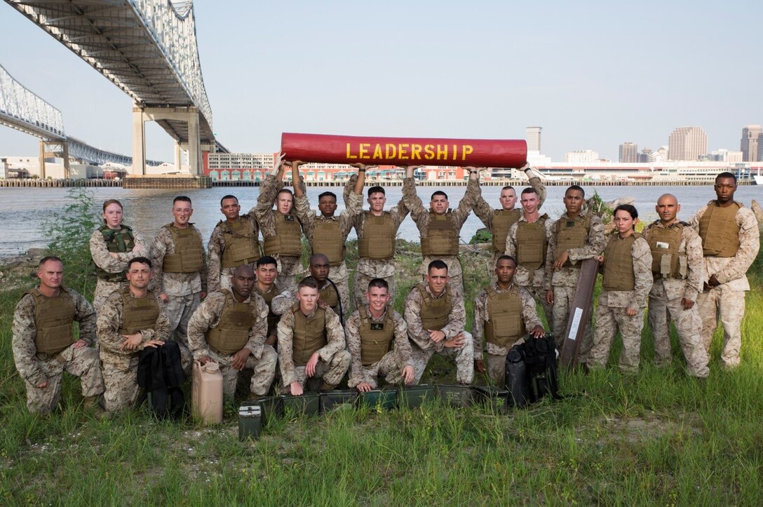 Marines in Corporals Course 4-16 pose for a photo at the halfway point during a casualty and resupply run at Marine Forces Reserve, Sept. 28, 2016. The course is designed to provide Marine Corps Corporals with knowledge and skills necessary to become successful small-unit leaders using problem-based situations they may encounter in the future. (U.S. Marine Corps photo by Cpl. Melissa Martens/ Released)  