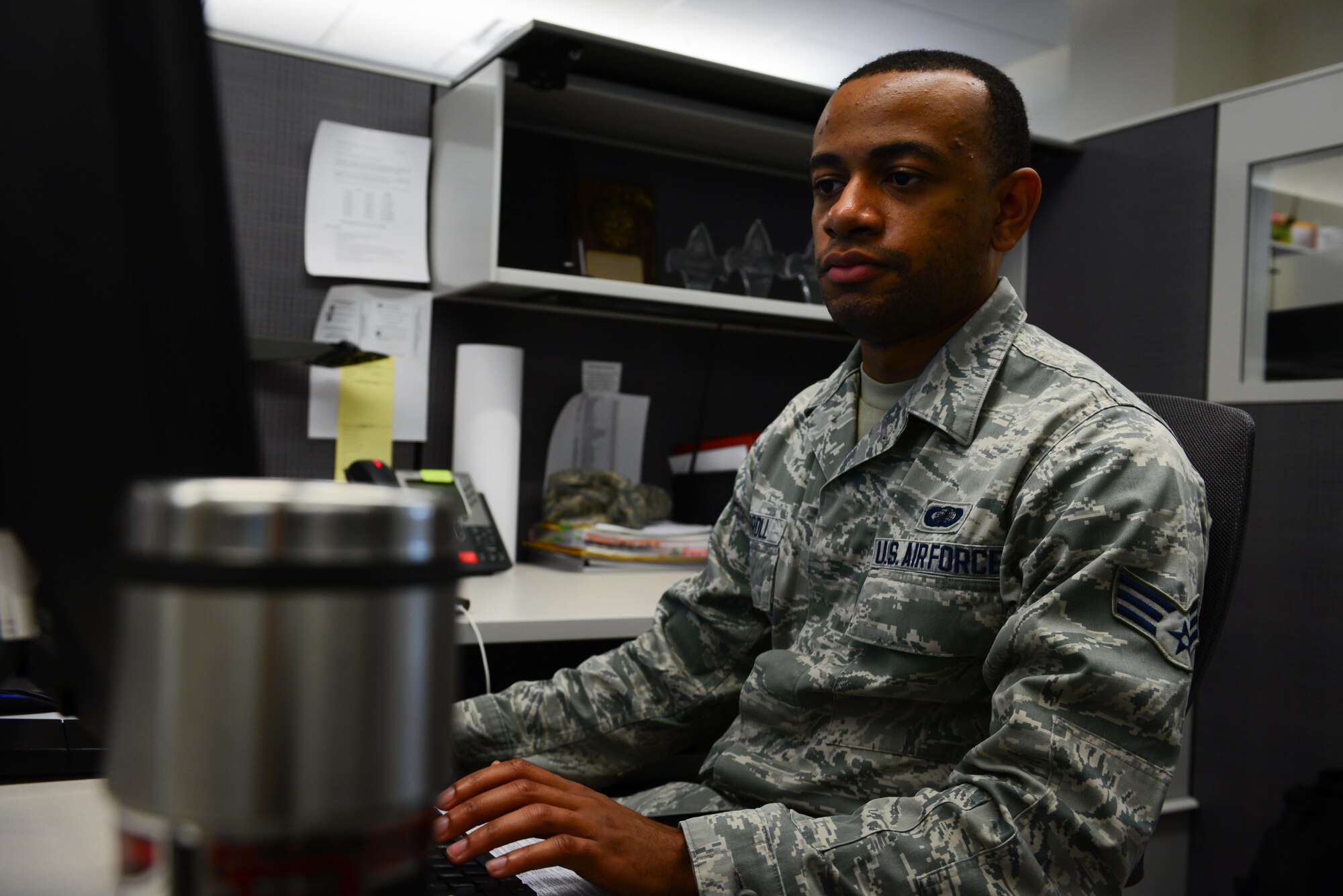 Senior Airman Justin Carroll, 2nd Contracting Squadron contract specialist, reviews a contract at Barksdale Air Force Base, La., Sept. 28, 2016. Contracting Airmen allocate funds to provide units on base the equipment and services they need. (U.S. Air Force photo/Senior Airman Luke Hill)