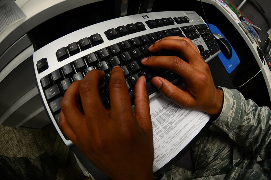 Senior Airman Justin Carroll, 2nd Contracting Squadron contract specialist, reviews a contract at Barksdale Air Force Base, La., Sept. 28, 2016. Contracts are reviewed by multiple contract specialists before they are approved and implemented. (U.S. Air Force photo/Senior Airman Luke Hill)