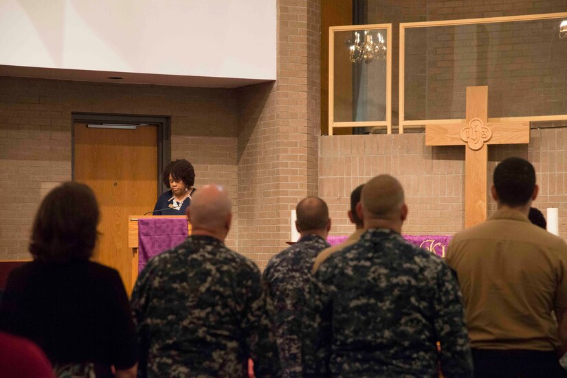 Angela Cottman, staff member at Joint Base Charleston's Fleet and Family Support Center, addresses the audience at the inaugural "Bells Across America" ceremony at All Saints Chapel on Joint Base Charleston-Naval Weapons Station September 22, 2016. Bells Across America is a ceremony that honors fallen servicemembers and is held each year on military installations around the world in conjunction with Gold Star Mothers and Families' Day.