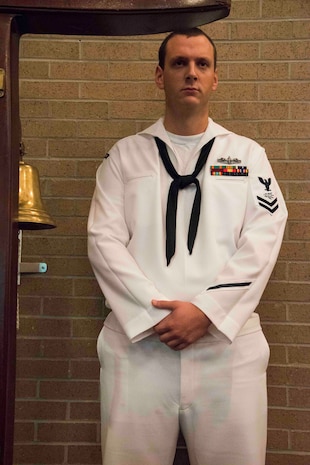 Information Systems Technician Second Class Michael Haskin stands by to ring the ceremonial bell at the inaugural "Bells Across America" ceremony at All Saints Chapel on Joint Base Charleston-Naval Weapons Station September 22, 2016. Bells Across America is a ceremony that honors fallen servicemembers and is held each year on military installations around the world in conjunction with Gold Star Mothers and Families' Day.