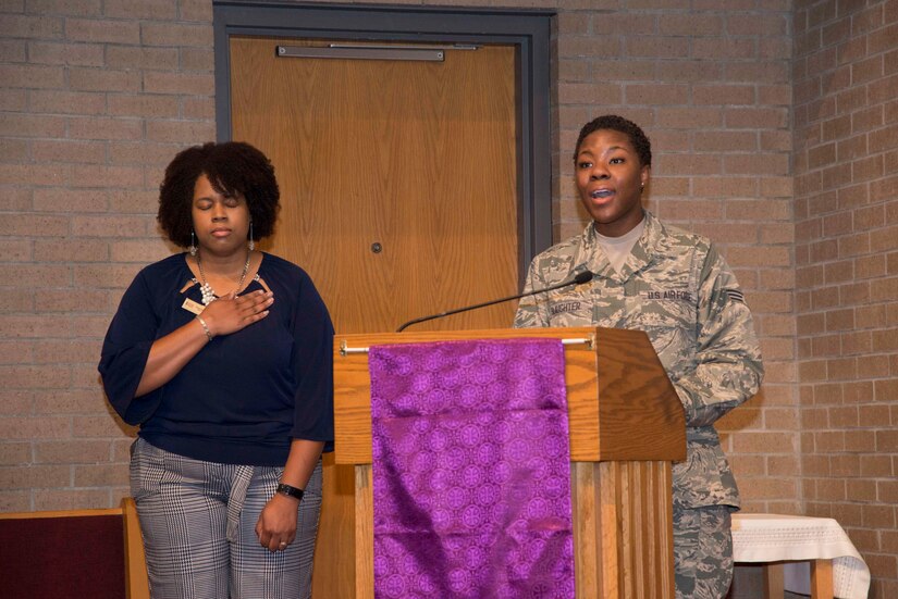 Air Force Senior Airman Khadija Slaughter performs the National Anthem at the inaugural "Bells Across America" ceremony at All Saints Chapel on Joint Base Charleston-Naval Weapons Station September 22, 2016. Bells Across America is a ceremony that honors fallen servicemembers and is held each year on military installations around the world in conjunction with Gold Star Mothers and Families' Day.