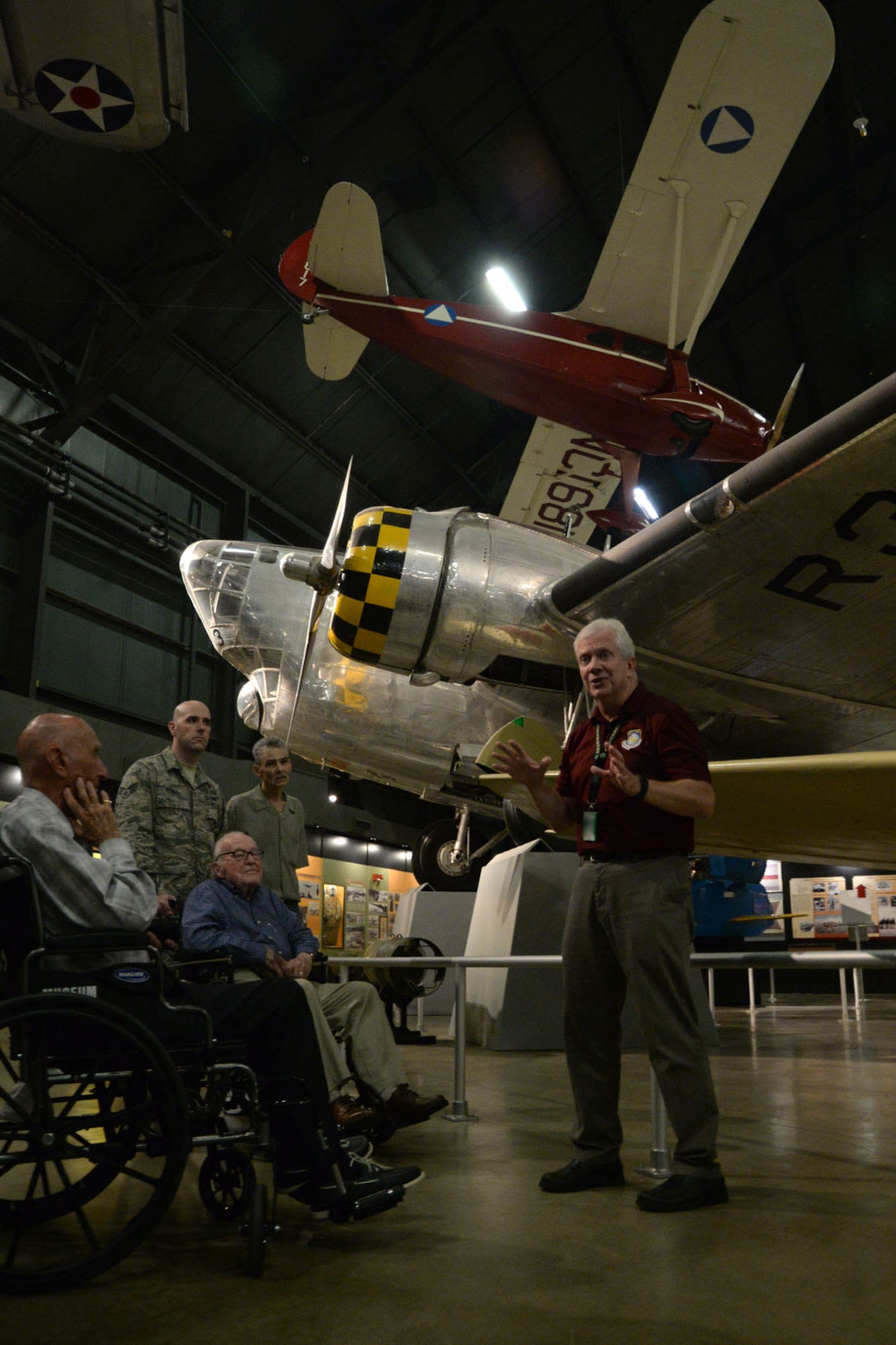 Robert Young, National Air and Space Intelligence Center historian, gives a tour of the National Museum of the U.S. Air Force to two U.S. Army Air Corps World War II veterans following a meet-and-greet session at the National Air and Space Intelligence Center on Wright-Patterson Air Force Base, Ohio, Sept. 23, 2016. The veterans, Milton Dienes (left) and John “Jerry” Johnson (middle), were assigned to the 9th Photographic Technical Squadron on Guam. During the war they were responsible for documenting and processing images from the atomic bomb blasts at Hiroshima and Nagasaki, Japan. (U.S. Air Force Photo/Master Sgt. Tammie Moore) 