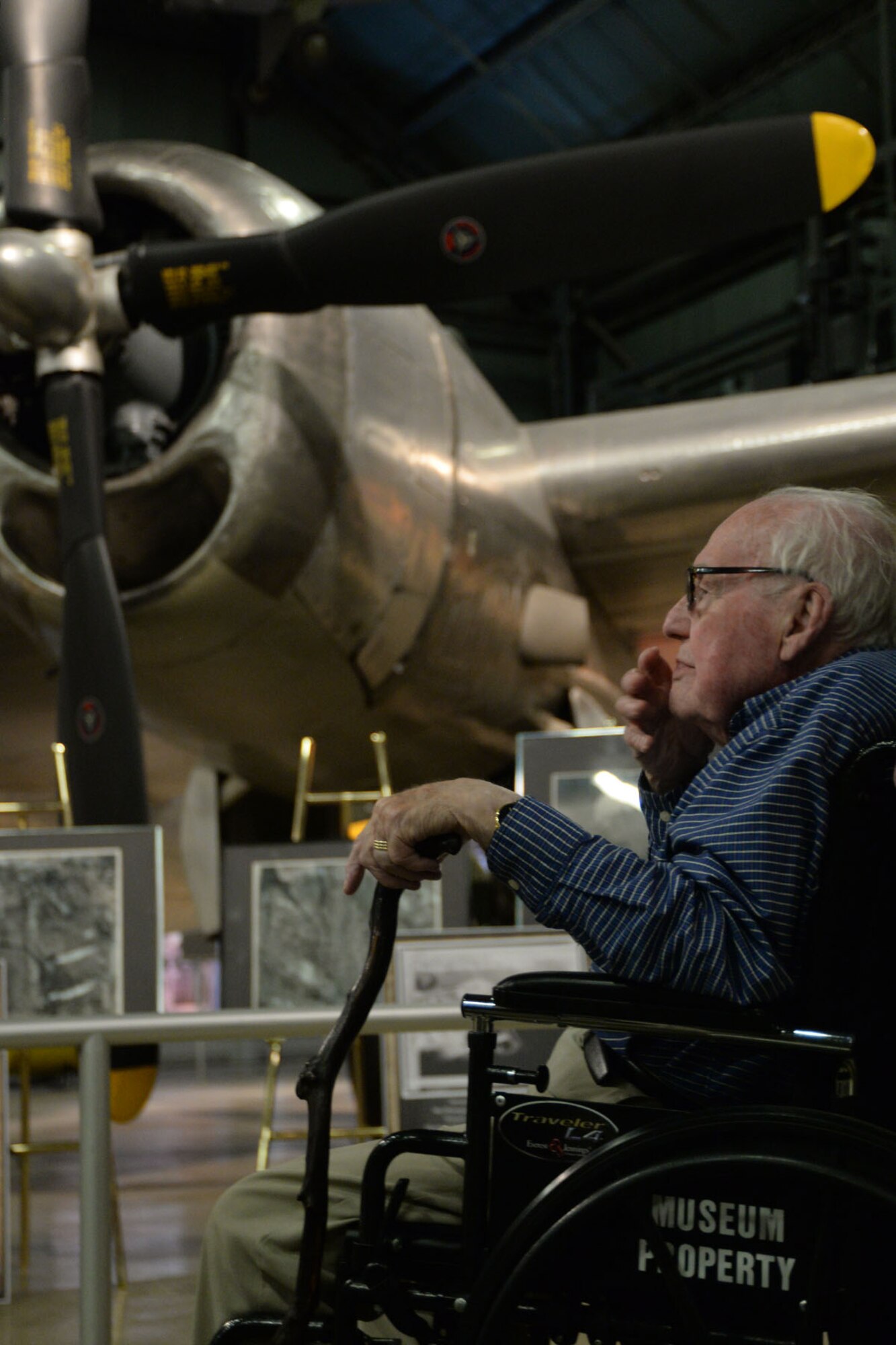 U.S. Army Air Corps World War II veteran John “Jerry” Johnson examines a display of photos, which includes images he processed of the atomic bombings on Japan in front of the B-29 bomber Bock’s Car, at the National Museum of the U.S. Air Force on Wright-Patterson Air Force Base, Ohio, Sept. 23, 2016. During the war, Johnson served in the 9th Photographic Technical Squadron which was responsible for processing imagery captured during and after the time of the atomic strikes on Hiroshima and Nagasaki. (U.S. Air Force Photo/Master Sgt. Tammie Moore) 