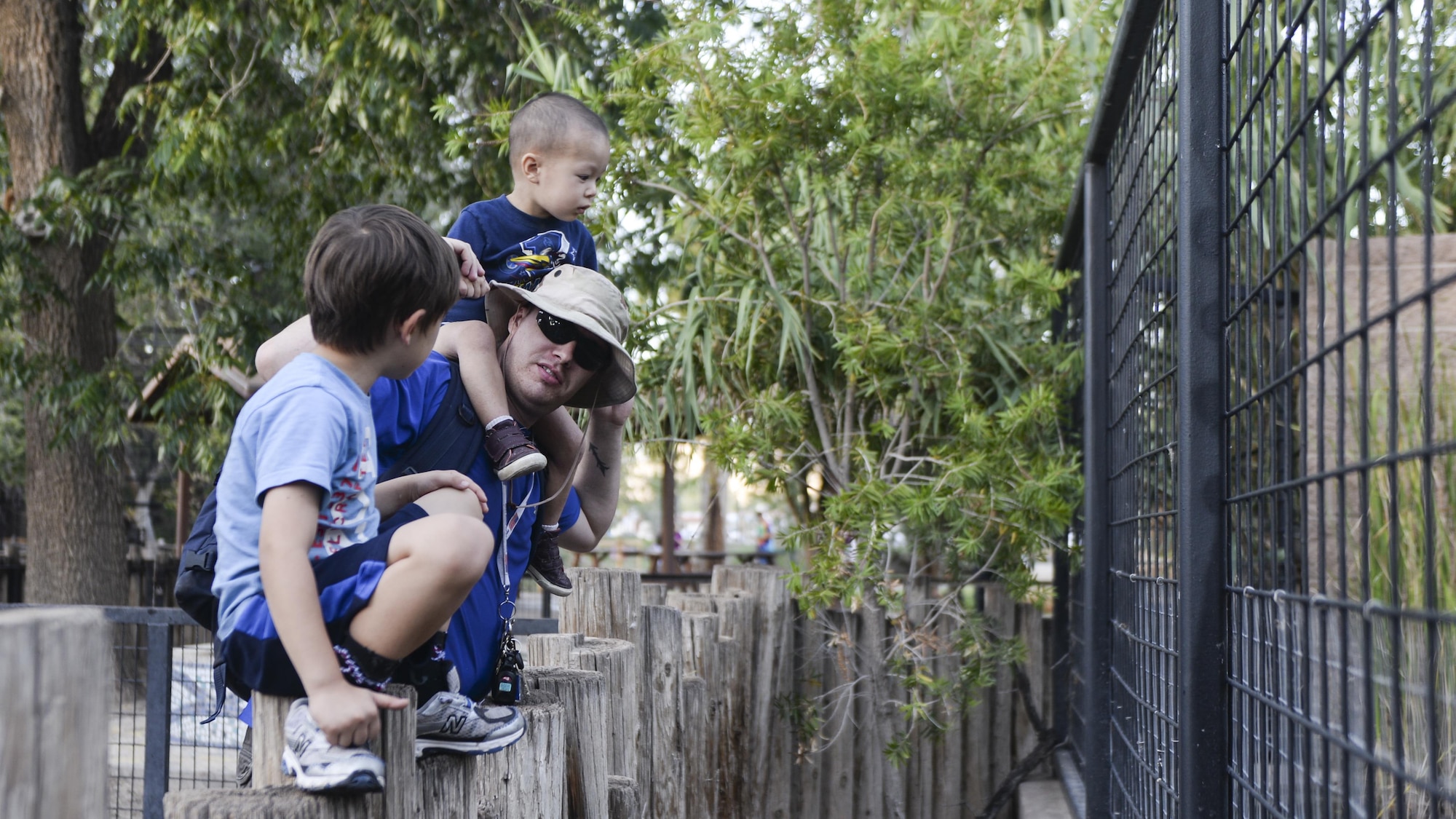 A father talks to his son while viewing an enclosure at the annual Zoo After Hours event at Alameda Park Zoo in Alamogordo, N.M. on Sept. 24, 2016. Zoo After Hours is a family-fun event that promotes family education. (U.S. Air Force photo by Airman 1st Class Alexis P. Docherty) 
