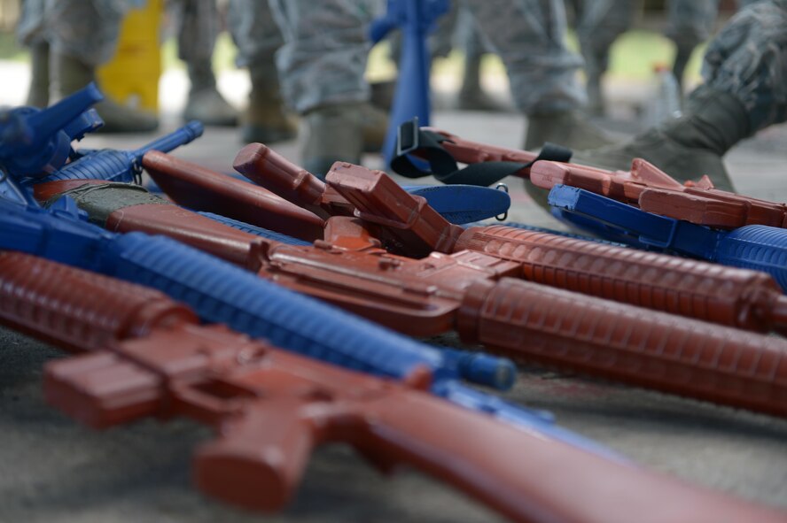 Training weapons rest on the ground at Barksdale Air Force Base, La., July 18, 2016. The 2nd SFS conducted an active shooter exercise where the objective was to locate and neutralize the shooter as soon as possible, while limiting potential casualties. (U.S. Air Force photo/Senior Airman Curt Beach)