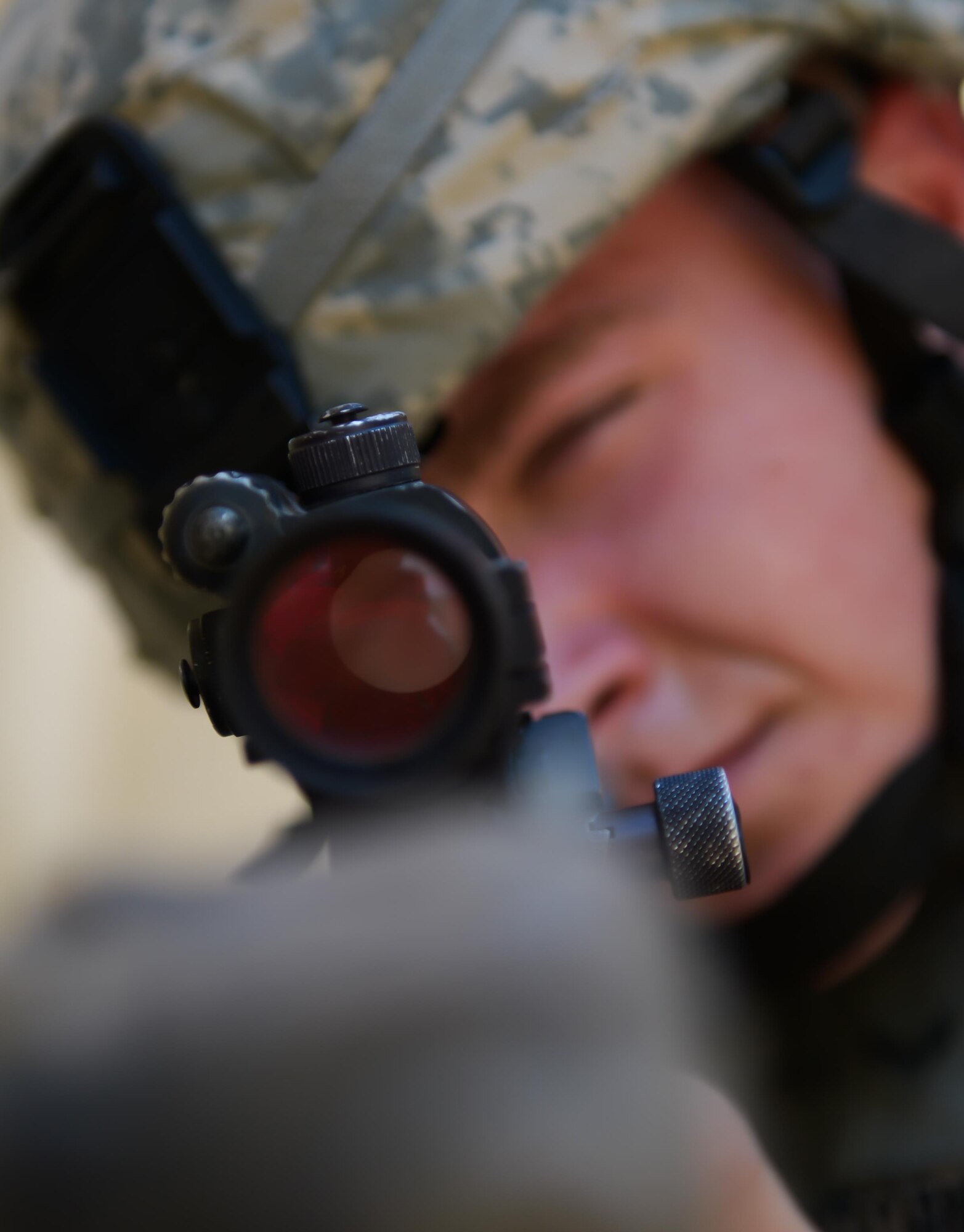 Airman 1st Class Tyler Storms, 2nd Security Forces Squadron entry controller, looks through the scope of his weapon at Barksdale Air Force Base, La., July 18, 2016. The 2nd SFS conducted an active shooter exercise where the objective was to locate and neutralize the shooter as soon as possible, while limiting potential casualties. (U.S. Air Force photo/Senior Airman Curt Beach)