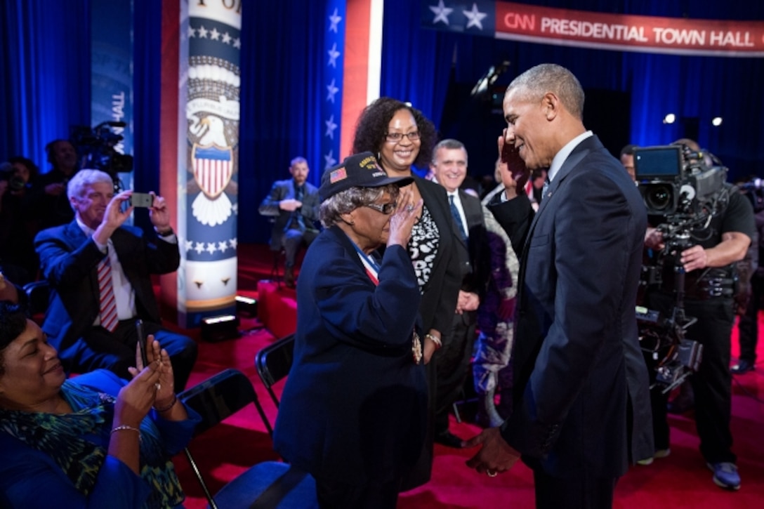 President Barack Obama returns a salute from Millie Dunn Veasey, who served as a staff sergeant in the Women’s Army Corps during World War II, during a town hall meeting at Fort Lee, Va., Sept. 28, 2016. The president discussed veterans, national security and foreign policy issues affecting the U.S. military at the event. White House photo by Pete Souza