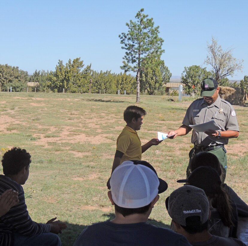 SANTA ROSA LAKE, N.M., -- Santa Rosa park ranger Paul Sanchez gives a certificate of appreciation to one of the volunteers after the lake’s National Public Lands Day event, Sept. 24, 2016.