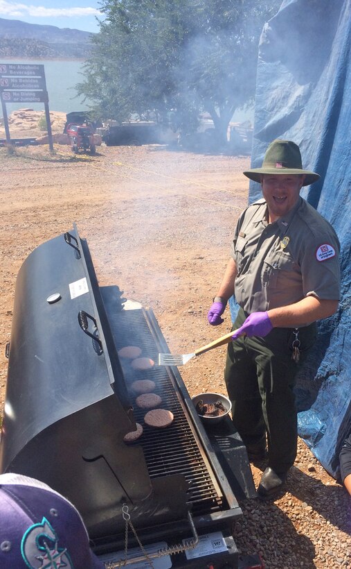 ABIQUIU LAKE, N.M., - Park manager John Mueller mans the grill, helping prepare lunch for the volunteers on National Public Lands Day, Sept. 24, 2016.