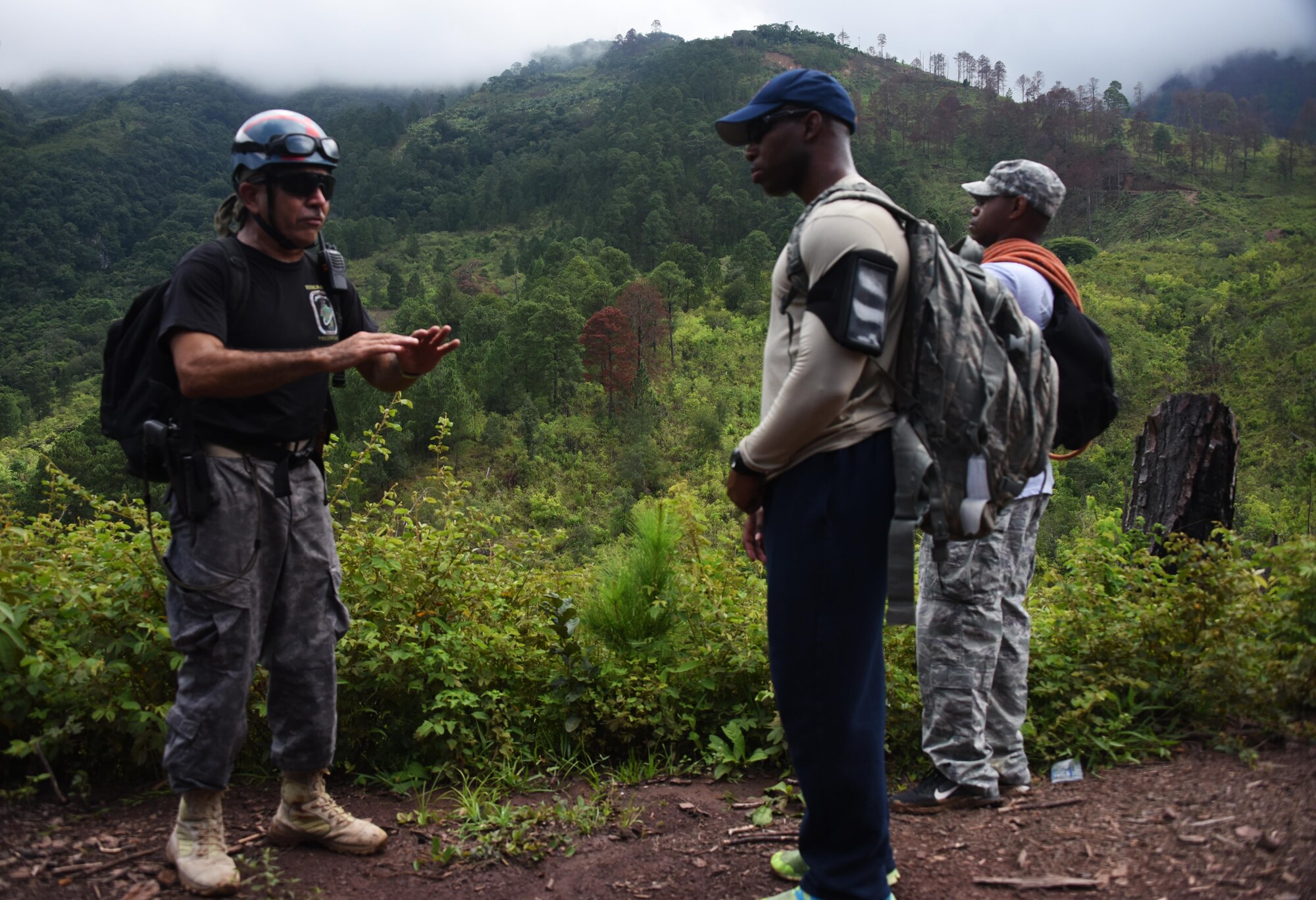 Herberth Gaekel, 612th Air Base Squadron Fire Department liaison at Soto Cano Air Base, Honduras, and PUMCIR (Personal Utilizado en Misiones Contra Incendio y Rescate – Personnel Used in Fire and Rescue) founder and instructor, pauses during a hike in Comayagua National Park near El Volcan, Honduras, Sept. 24, 2016, to explain to U.S. Air Force Airmen assigned to Joint Task Force-Bravo how he decided to form the volunteer organization in 1994 after learning of a tragic story involving the loss of life that might have been prevented had there been search and rescue capabilities in that area. Since then, Gaekel has led and funded the training of more than 750 PUMCIR volunteers from all over Honduras and has responded to more than a hundred calls for assistance. (U.S. Air Force photo by Capt. David Liapis)