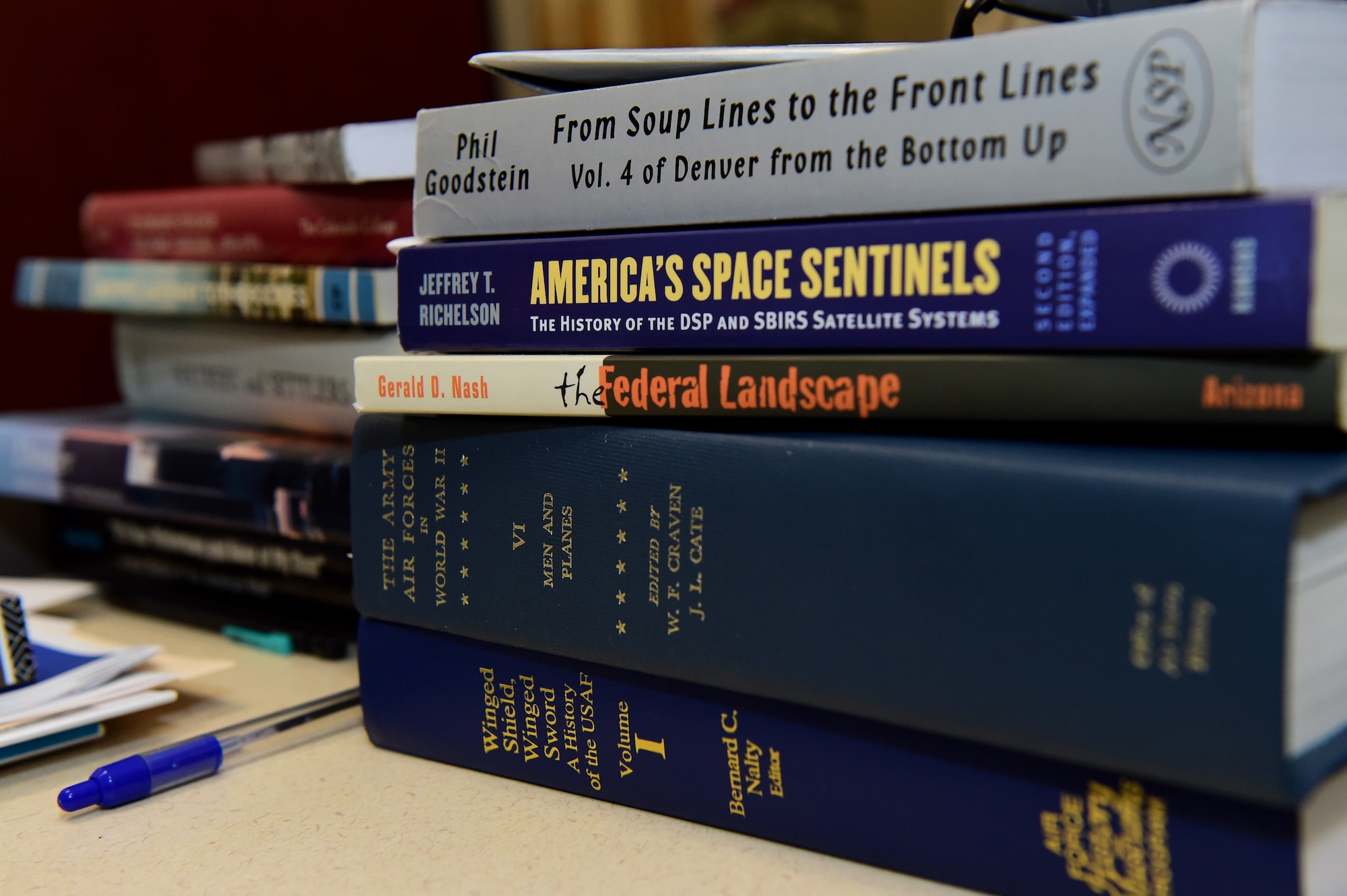 History books are displayed on the desk of Christopher McCune, 460th Space Wing historian, Sept. 26, 2016, at the 460th Space Wing Headquarters building on Buckley Air Force Base, Colo. McCune is responsible for providing the wing commander and the base community with special studies on various subjects that relate to the history of Buckley AFB and the 460th SW. (U.S. Air Force photo by Airman 1st Class Gabrielle Spradling/Released)