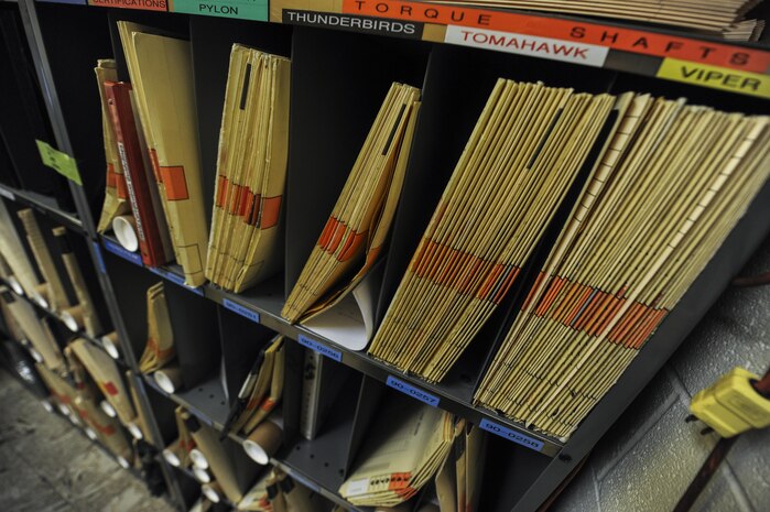 X-rays of aircraft parts sit on a shelf in the Non-destructive Inspection lab on Nellis Air Force Base, Nev., Sept. 28. The NDI Lab at Nellis AFB is unique in the way that the technicians get to inspect many different weapons systems and aircraft. (U.S. Air Force photo by Airman 1st Class Kevin Tanenbaum/Released)