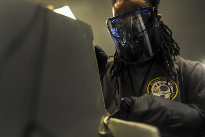Corey Dewese, M1 non-destructive inspection technician, performs a test for cracks in a missile mount in the NDI Lab on Nellis Air Force Base, Nev., Sept. 28. The NDI Lab helps ensure the structural integrity of aircraft and sub-assemblies, as well as ensure the safety of the pilots and personnel on the ground. (U.S. Air Force photo by Airman 1st Class Kevin Tanenbaum/Released)