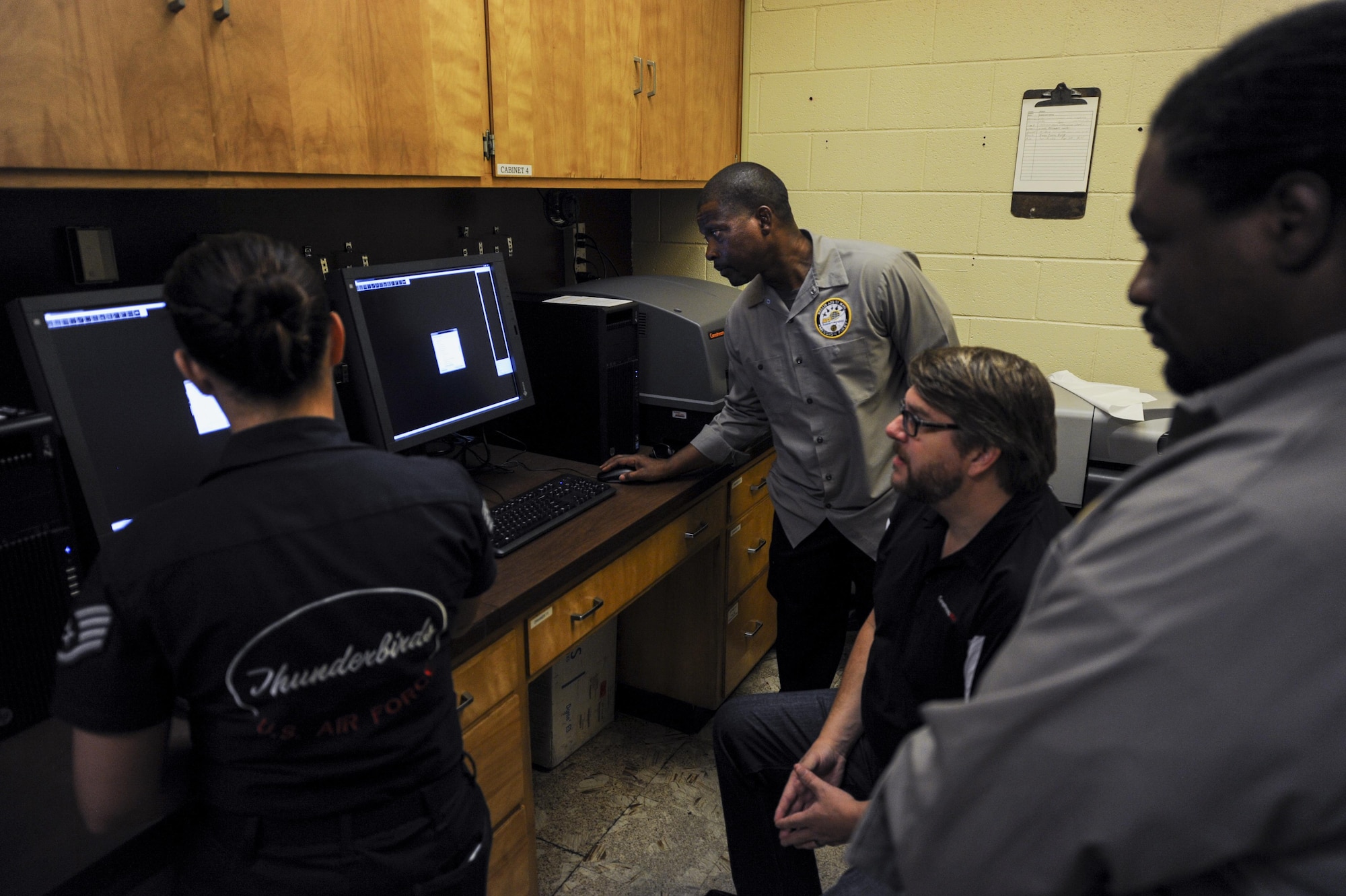 Non-destructive inspection technicians receive training on a new x-ray process in the NDI lab on Nellis Air Force Base, Nev., Sept. 28.  All NDI technicians are certified per the National Aerospace Standard 410 and must complete a battery of exams prior to certification, and must complete the recertification process every five years. (U.S. Air Force photo by Airman 1st Class Kevin Tanenbaum/Released)