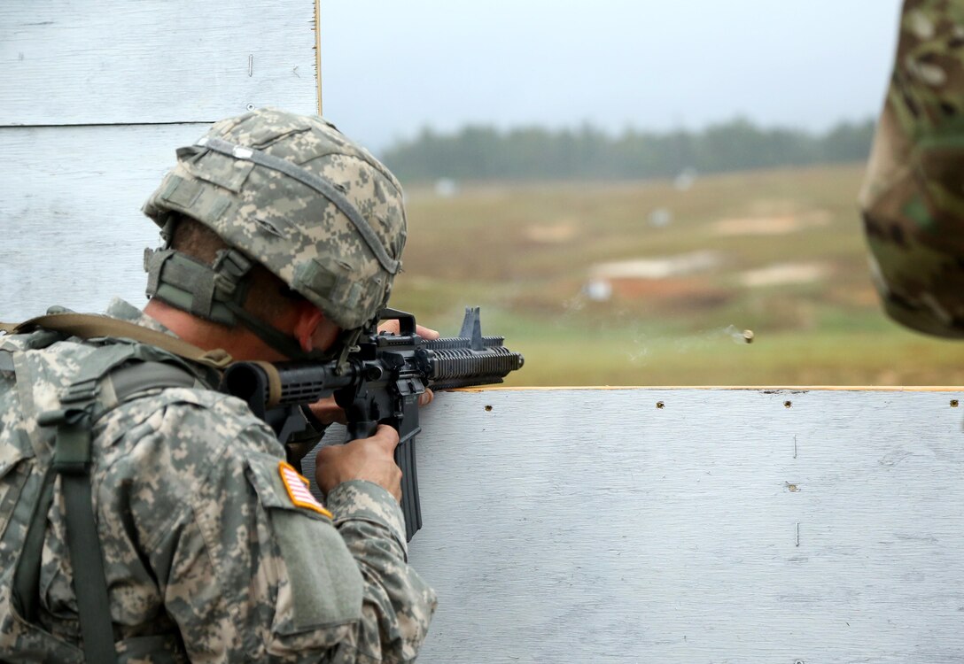 U.S. Army Spc. Michael Orozco, assigned to U.S. Army Reserve Command, fires an M4 carbine during the U.S. Army 2016 Best Warrior Competition (BWC) at Fort A.P. Hill, Va., Sept. 28, 2016. The BWC is an annual weeklong event that will test 20 Soldiers from 10 major commands on their physical and mental capabilities. The top NCO and Soldier will be announced Oct. 3, in Washington DC. (U.S Army photo by Pfc. Jada Owens).