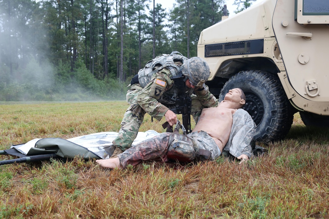 U.S. Army Sgt. 1st Class, Joshua Moeller, assigned to U.S. Army Reserve Command, demonstrates his marksmanship and tactical combat casualty care capabilities during a live-fire exercise on Day Three of the U.S. Army 2016 Best Warrior Competition (BWC) at Fort A.P. Hill, Va., Sept. 28, 2016. The BWC is an annual weeklong event that will test 20 Soldiers from the 10 major commands Army-wide, on their physical and mental capabilities. The top NCO and Soldier will be announced Oct. 3, in Washington DC. (U.S. Army photo by Spc. Michel'le Stokes).