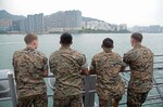Marines, assigned to the 31st Marine Expeditionary Unit (MEU), look on as the amphibious assault ship USS Bonhomme Richard (LHD 6) pulls into the harbor of Hong Kong as part of a scheduled port visit, Sept. 23, 2016) Bonhomme Richard Expeditionary Strike Group, with embarked 31st MEU, is in Hong Kong to experience the city’s rich culture and history as part of their multi-month patrol in the region.

