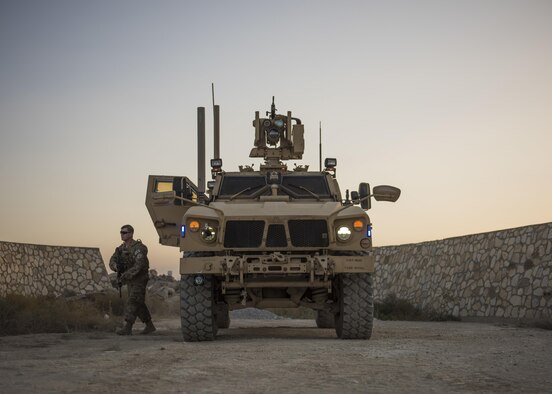 Senior Airman Michael Van Deusen, of the 455th Expeditionary Security Forces Squadron quick reaction force, gets out of a mine-resistant, ambush-protected vehicle during a patrol at Bagram Airfield, Afghanistan, Sept. 27, 2016. MRAPs are used by the 455th ESFS to secure the flightline. (U.S. Air Force photo/Senior Airman Justyn M. Freeman)