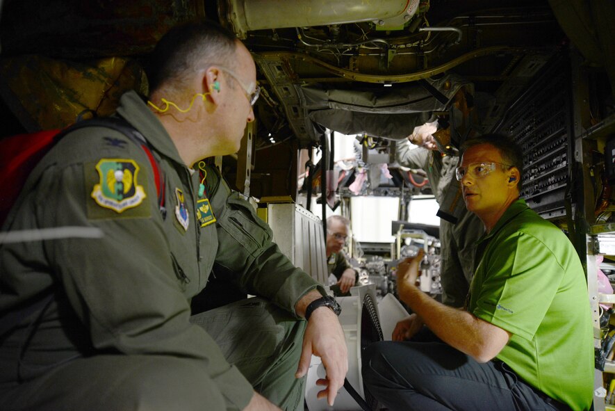 Col. Doug Warnock, 5th Operations Group commander, a member of the B-52 crew from Minot Air Force Base, N.D., that came to take the “Ghost Rider” home, gets a first-hand look at the installation of the Combat Network Communication Technology system from Mr. Heath Burnett, B-52H Avionics/Electrics Section Chief. Colonel Warnock was joined on the Sept. 27 tour of the B-52 programmed depot maintenance line by other crew members Lt. Col. Ryan McGough, Lt. Col. Jeremy Holmes, 1st Lt. Adam Carr and 1st Lt. Nathan Fisher. (Air Force photo by Kelly White)
