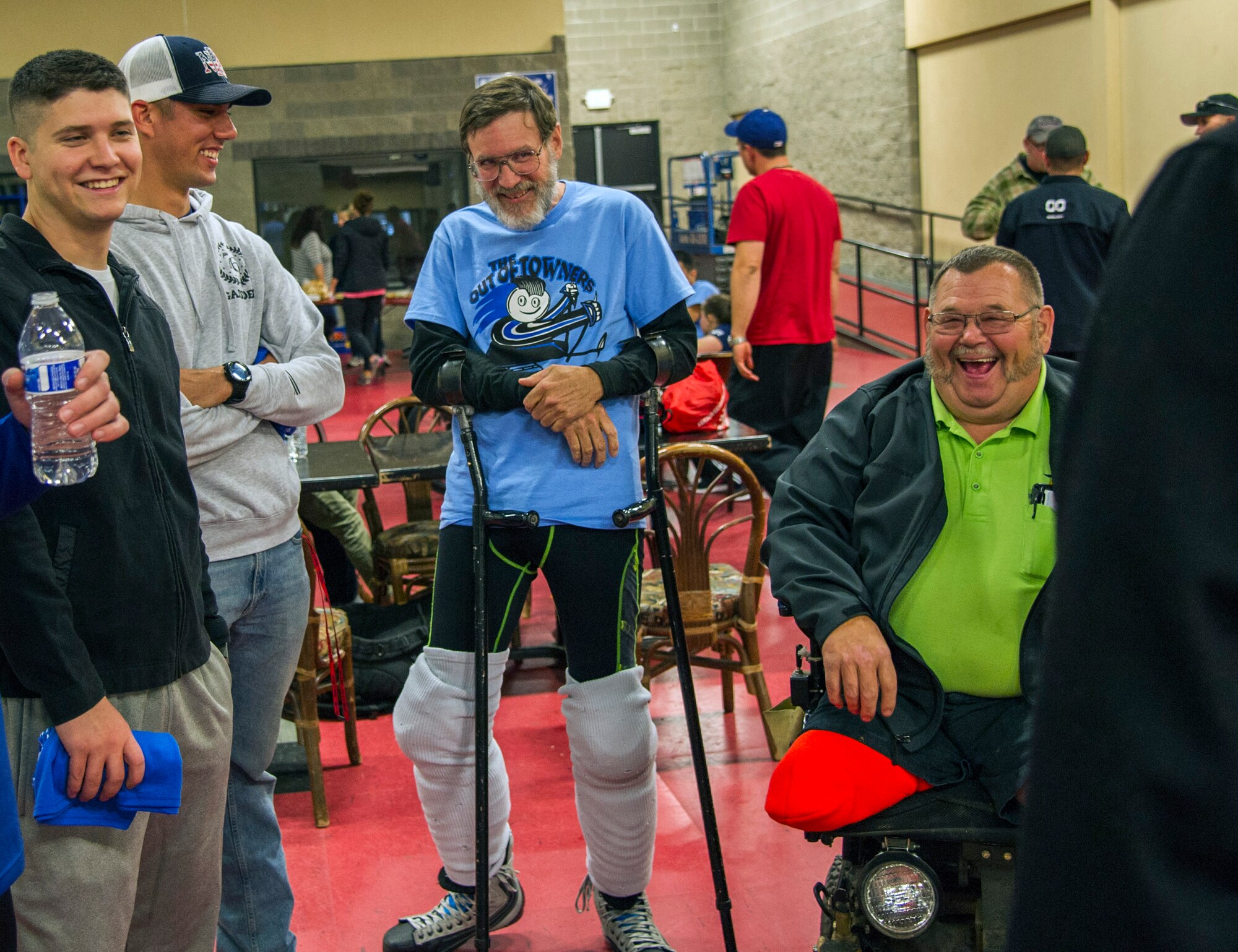 Members of the Fairchild Falcons varsity hockey team share stories with sled hockey members before an exhibition match at the Frontier Ice Arena here in Coeur d’Alene, Idaho, Sept. 23, 2016. The game kicked off the regional two-day tournament, which featured sled hockey teams from Montana, Washington, Texas and Idaho, and included firefighters from the nearby Kootenai County Fire Department. (U.S. Air Force photo/Tech. Sgt. Travis Edwards)